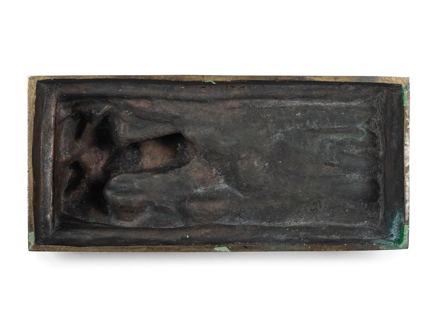 A Cast Bronze Figure of a Reclining Nude Woman