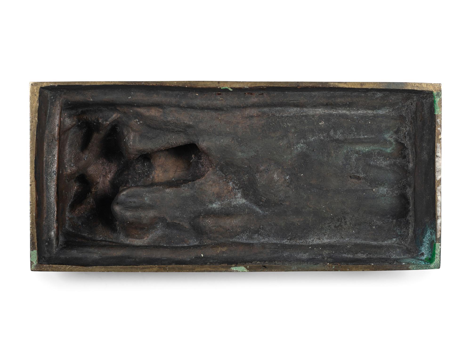 A Cast Bronze Figure of a Reclining Nude Woman