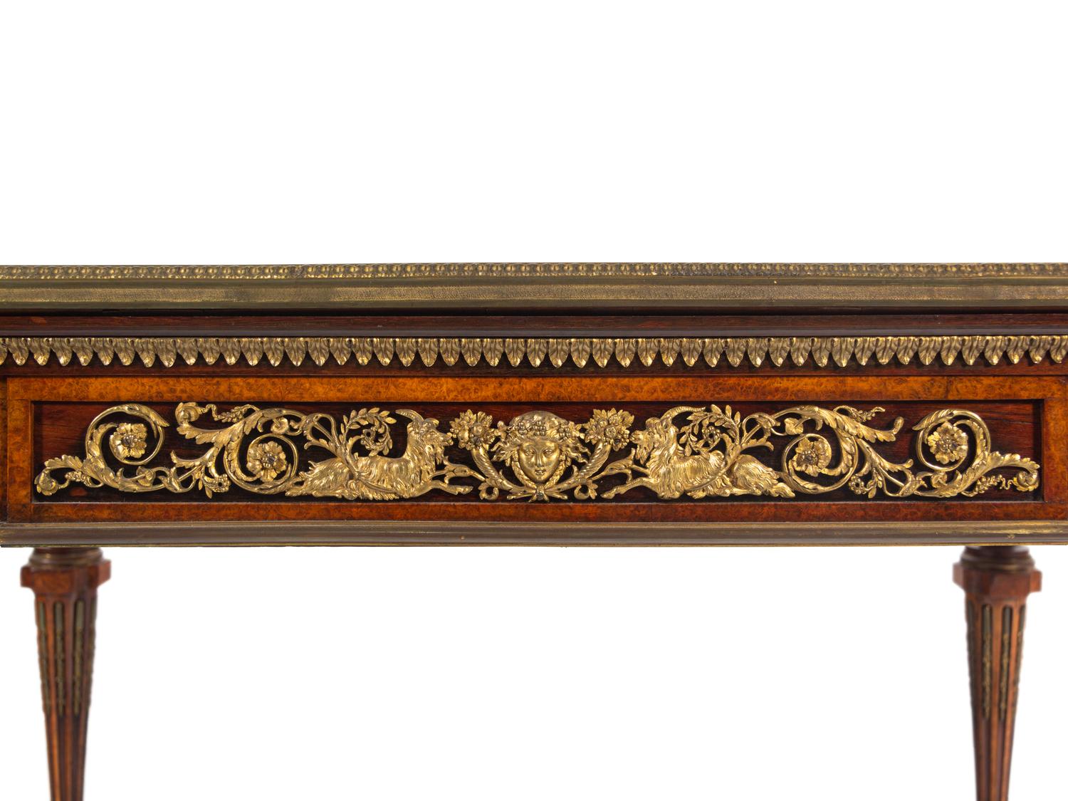 A Napoleon III Velvet-Inset and Gilt Bronze Mounted Amboyna Center Table
