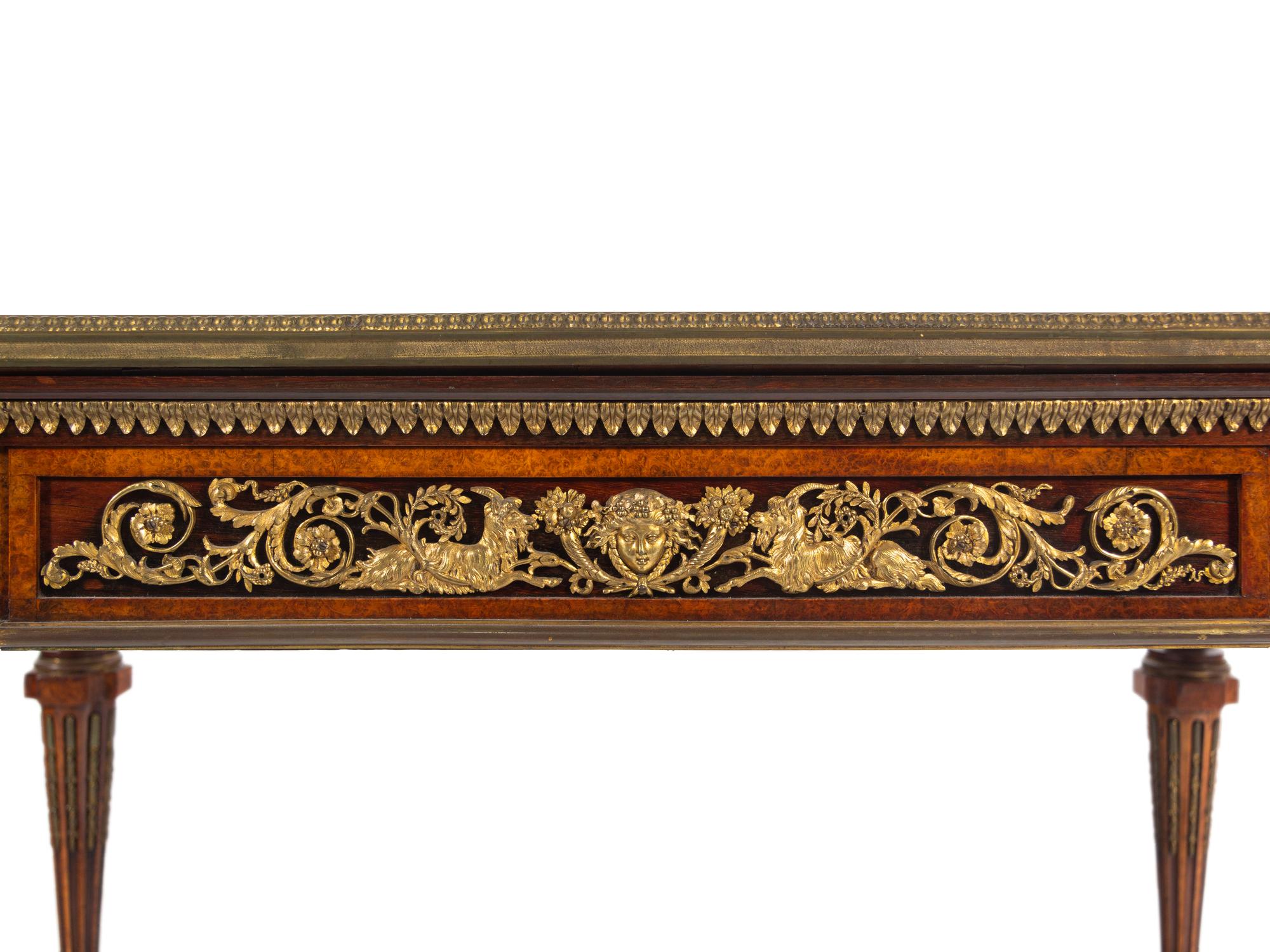 A Napoleon III Velvet-Inset and Gilt Bronze Mounted Amboyna Center Table