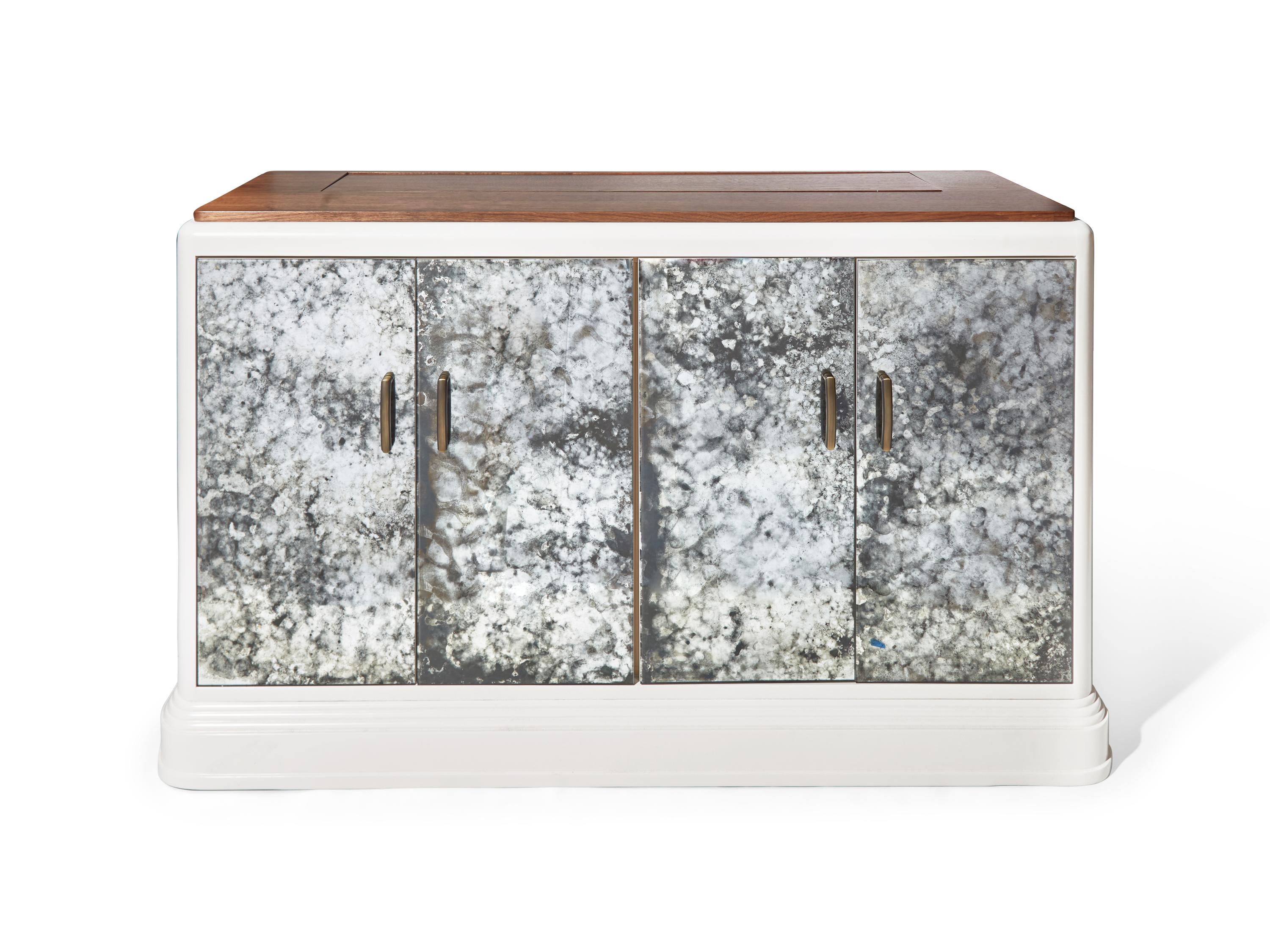 An Antiqued Mirror Mechanized Television Console DONATED BY S.R. GAMBREL, INC.