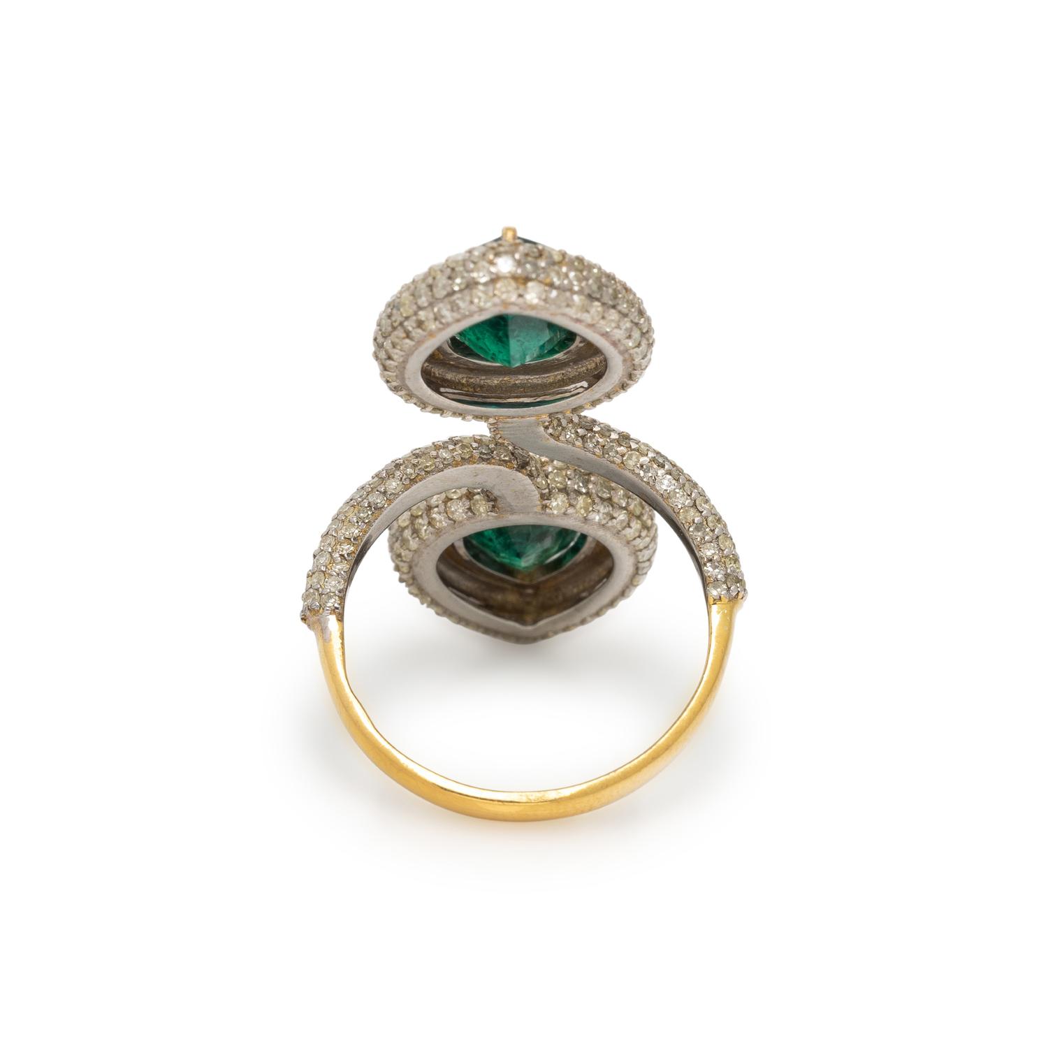 EMERALD AND DIAMOND BY-PASS RING