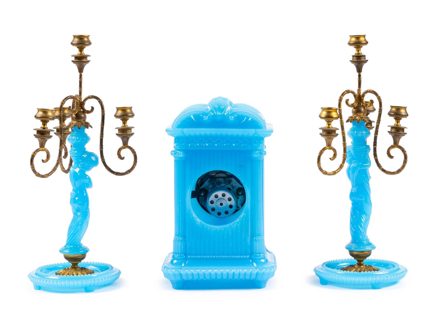 A Continental Blue Opaline Glass Three-Piece Clock Garniture