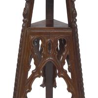 A Pair of Neogothic Carved Oak Jardiniere Stands