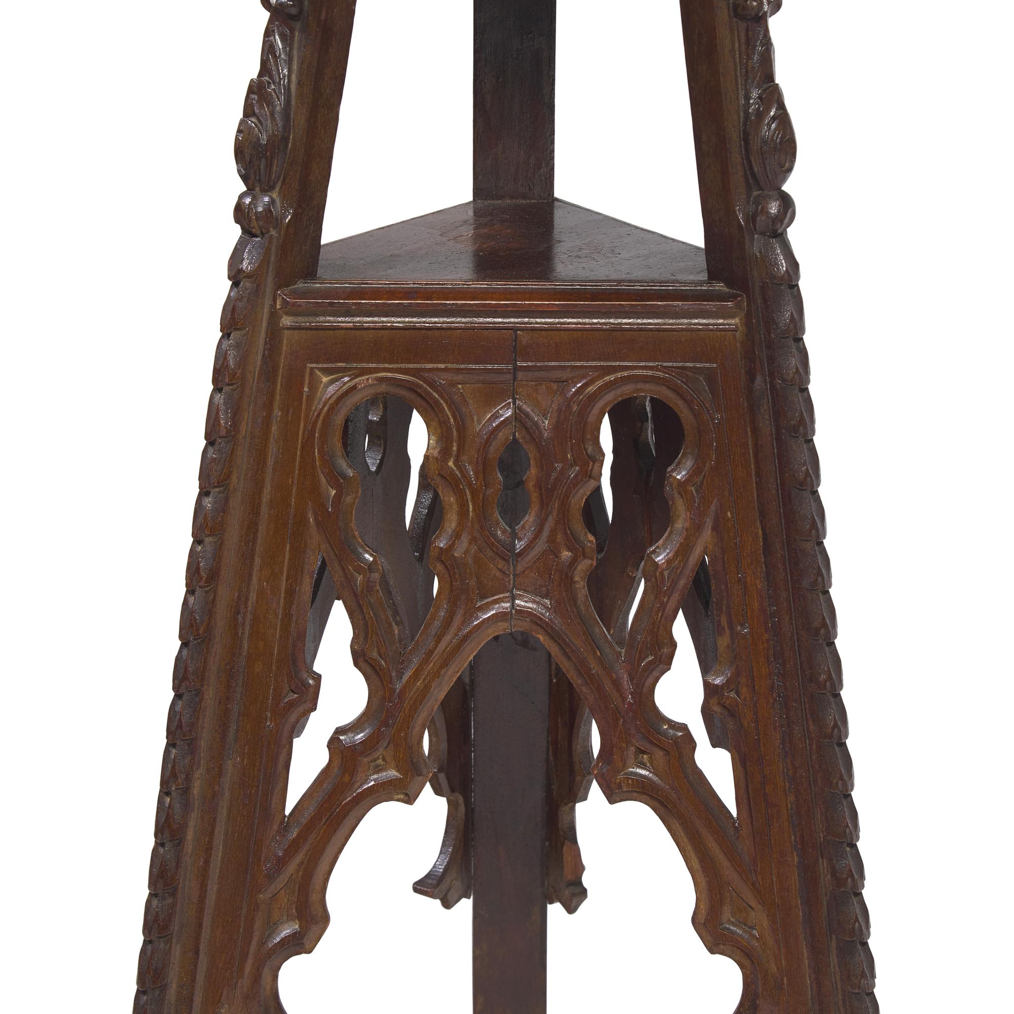 A Pair of Neogothic Carved Oak Jardiniere Stands