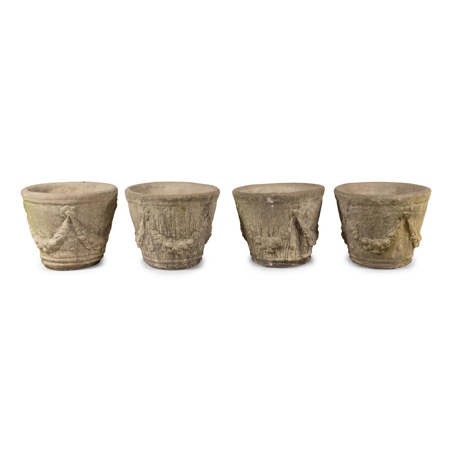 A Set of Four Cast Stone Jardinières