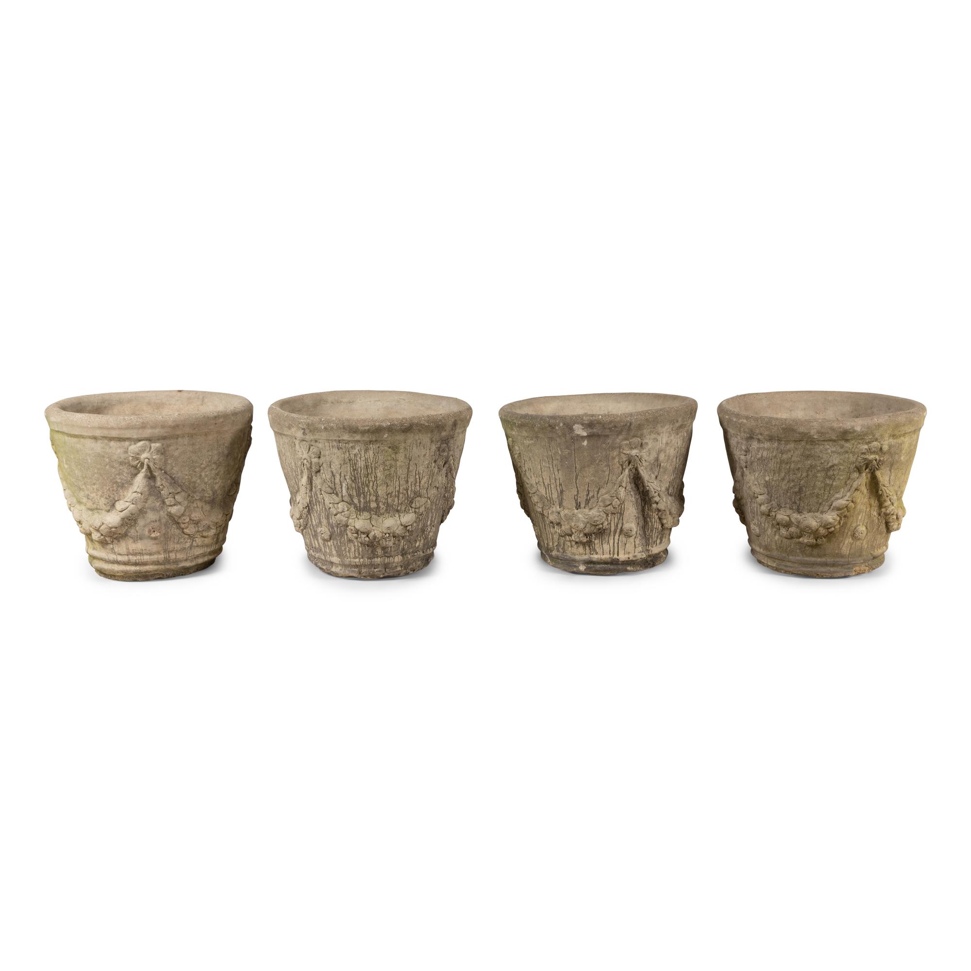 A Set of Four Cast Stone Jardinières