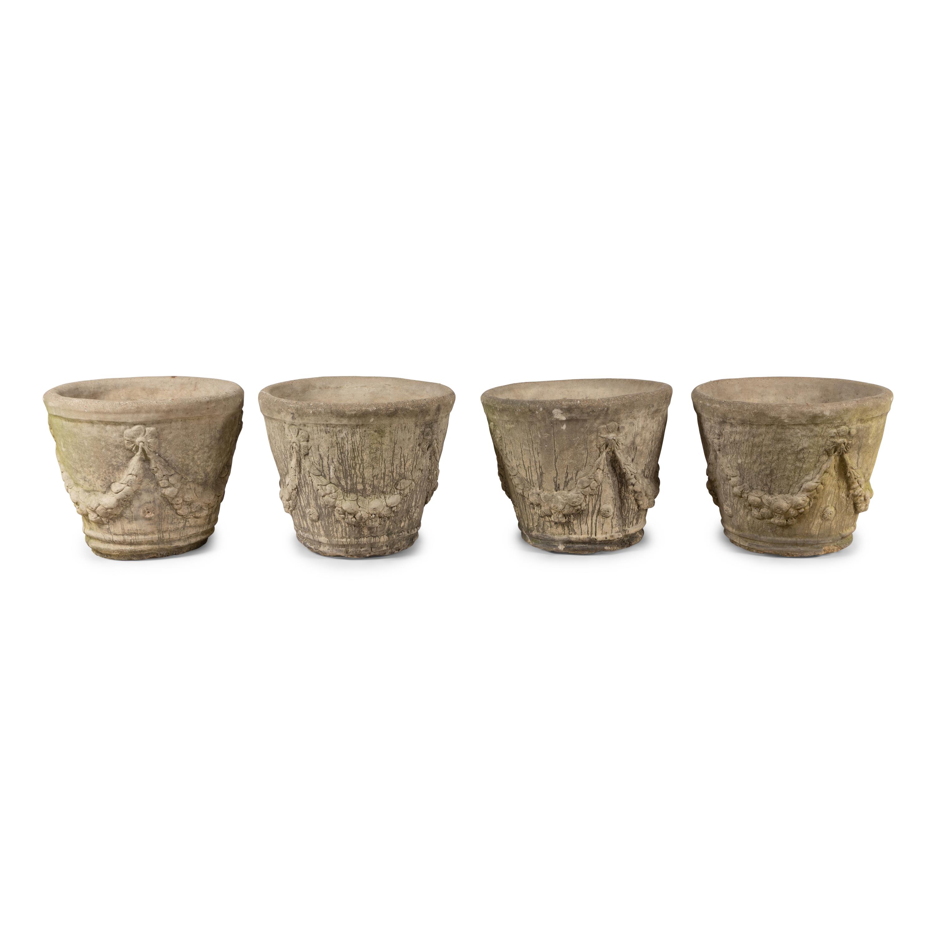 A Set of Four Cast Stone Jardinières