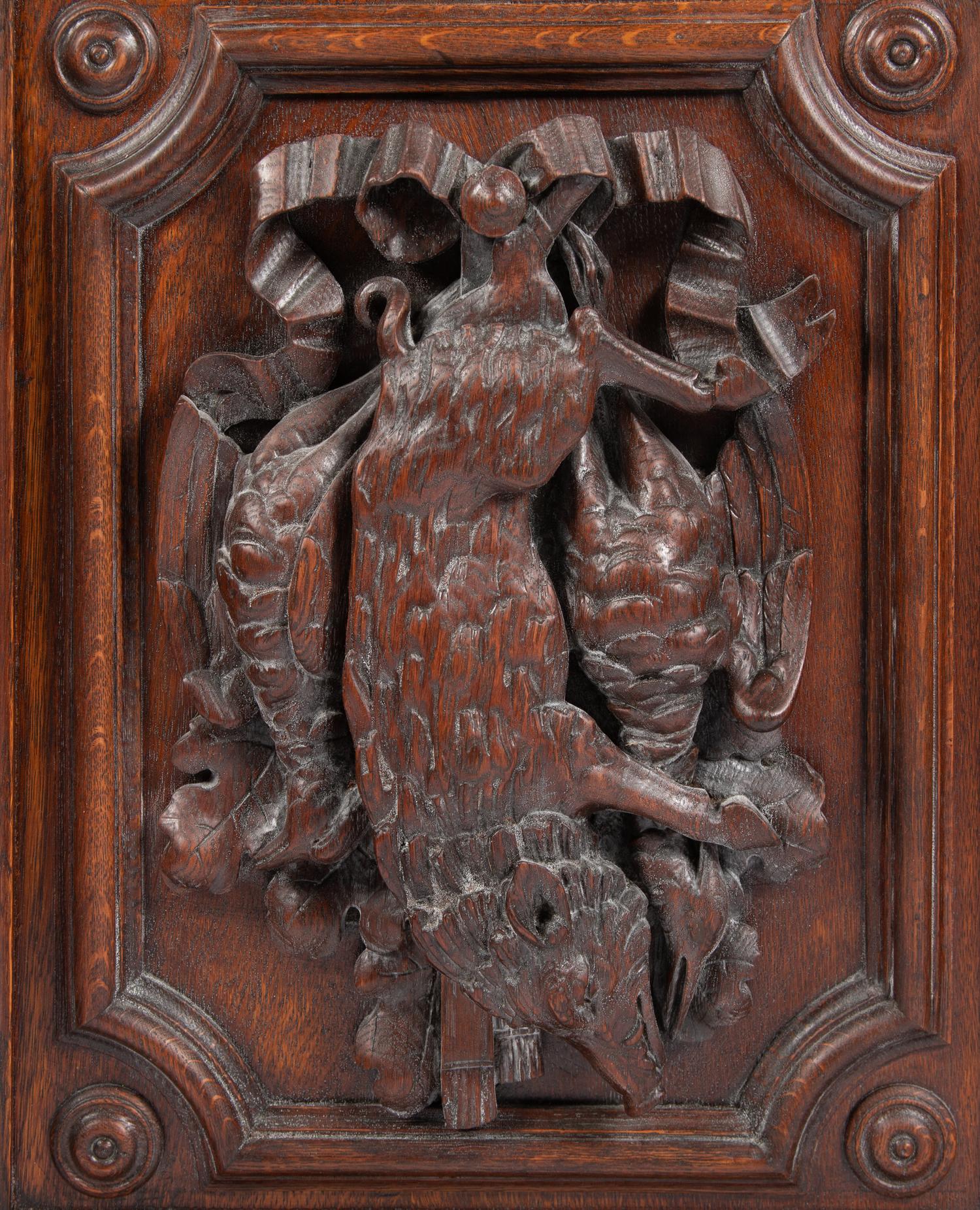 A Continental Carved Oak Cabinet