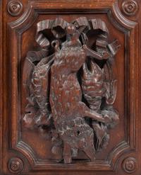 A Continental Carved Oak Cabinet