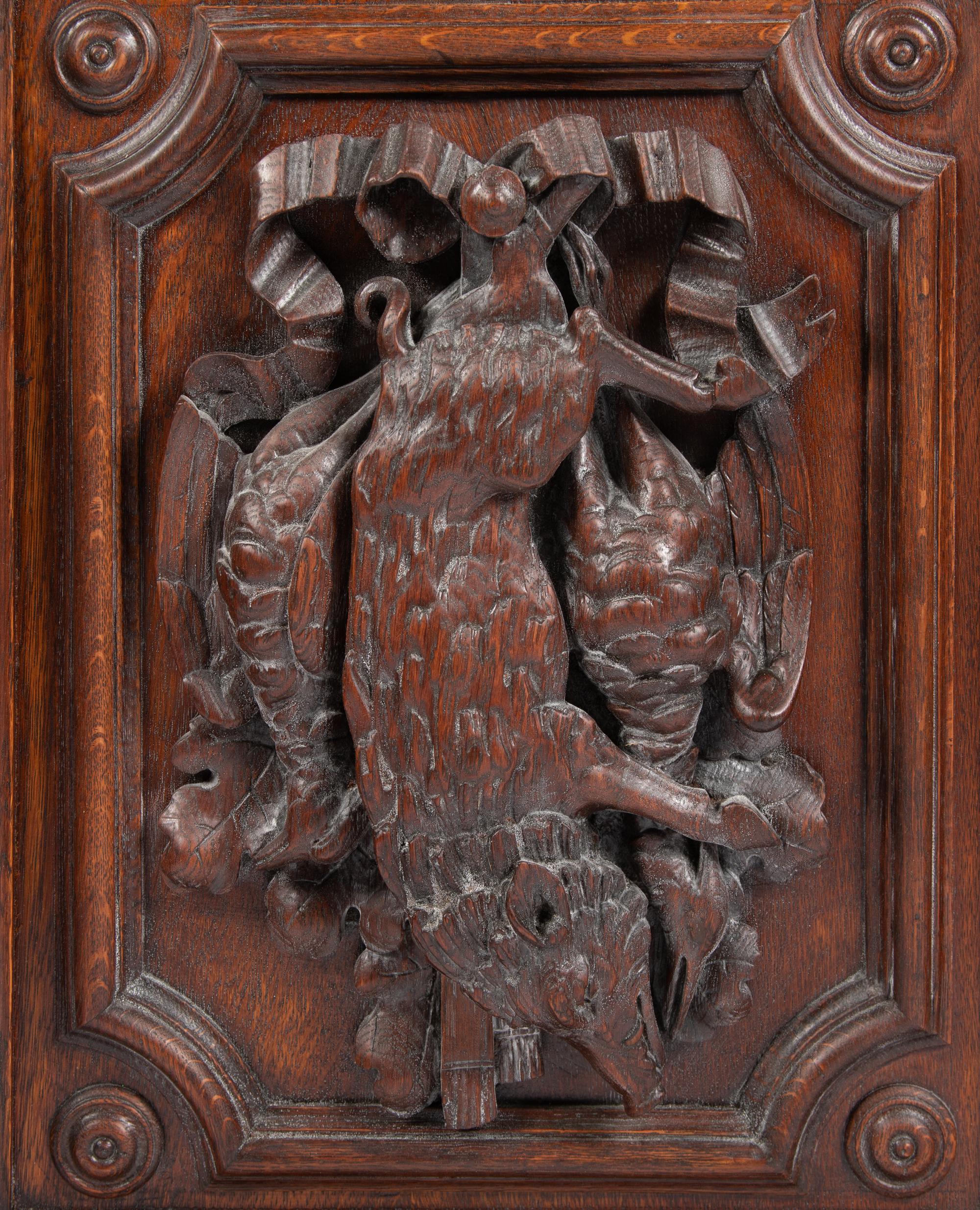 A Continental Carved Oak Cabinet