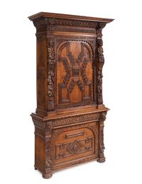 An Italian Renaissance Revival Carved Oak Cabinet