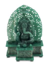 A Carved Green Jasper Figure of a Deity
