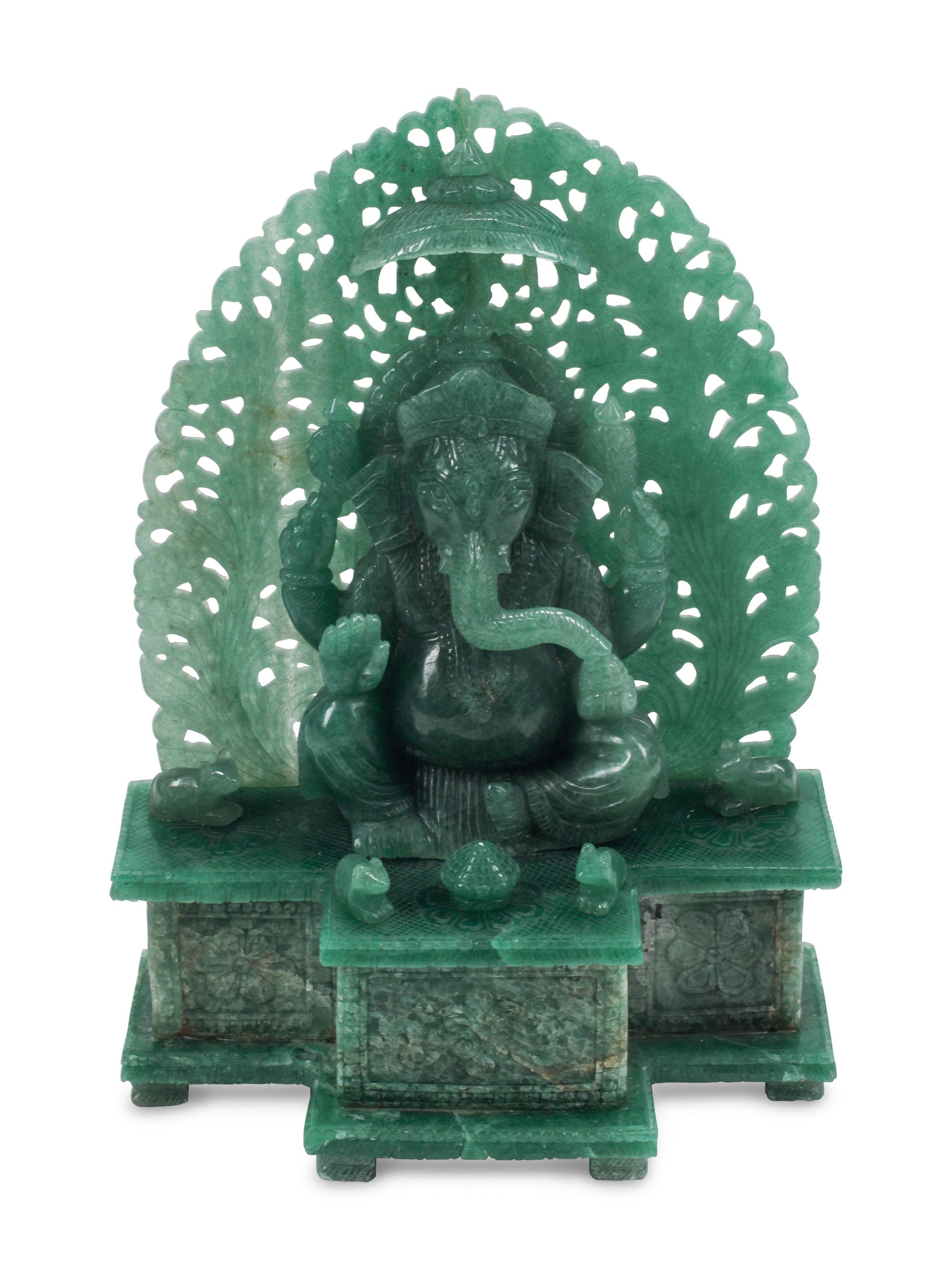 A Carved Green Jasper Figure of a Deity
