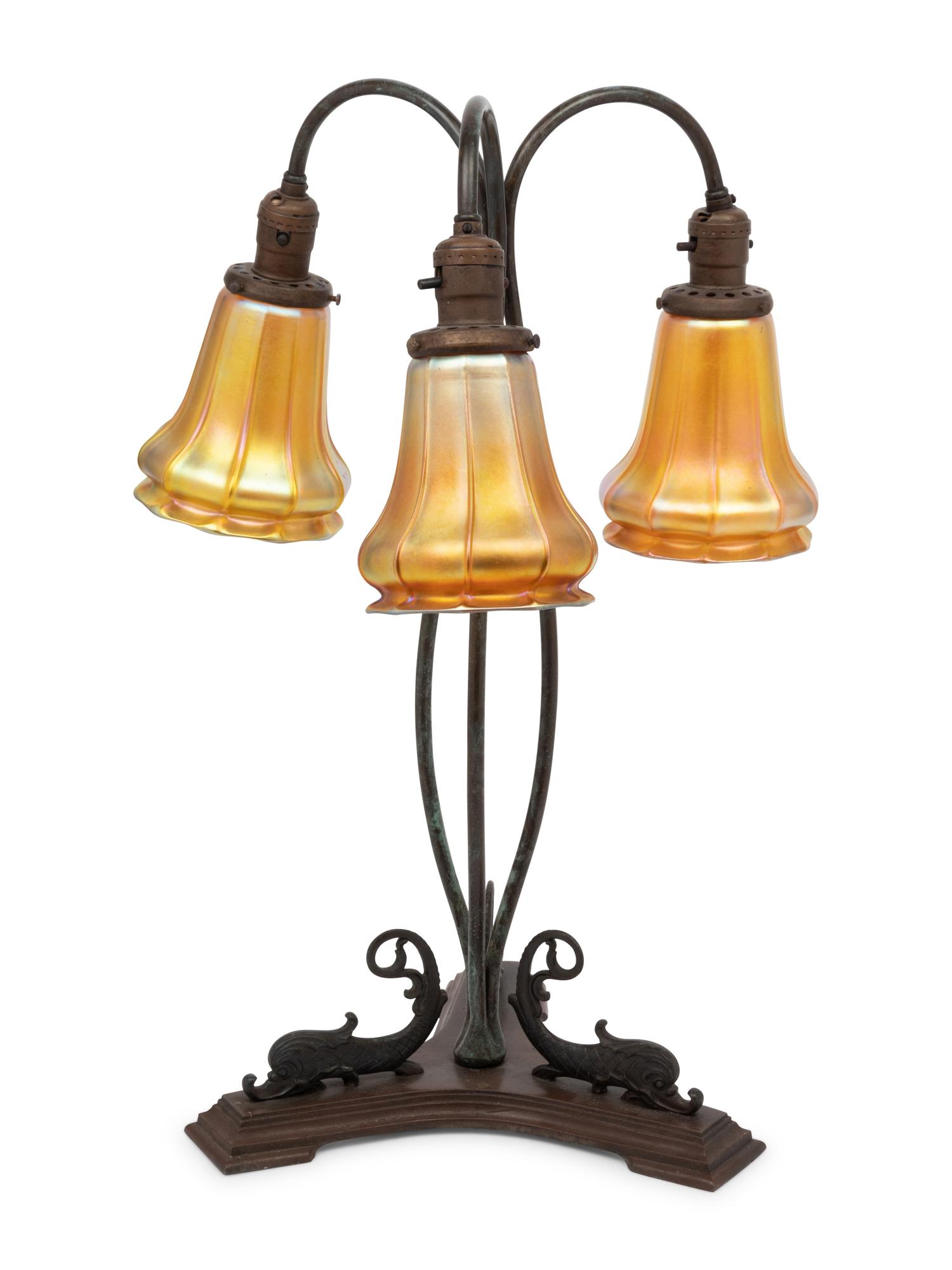 A Cast Metal Three-Light Lamp with Quezal Aurene Glass Shades