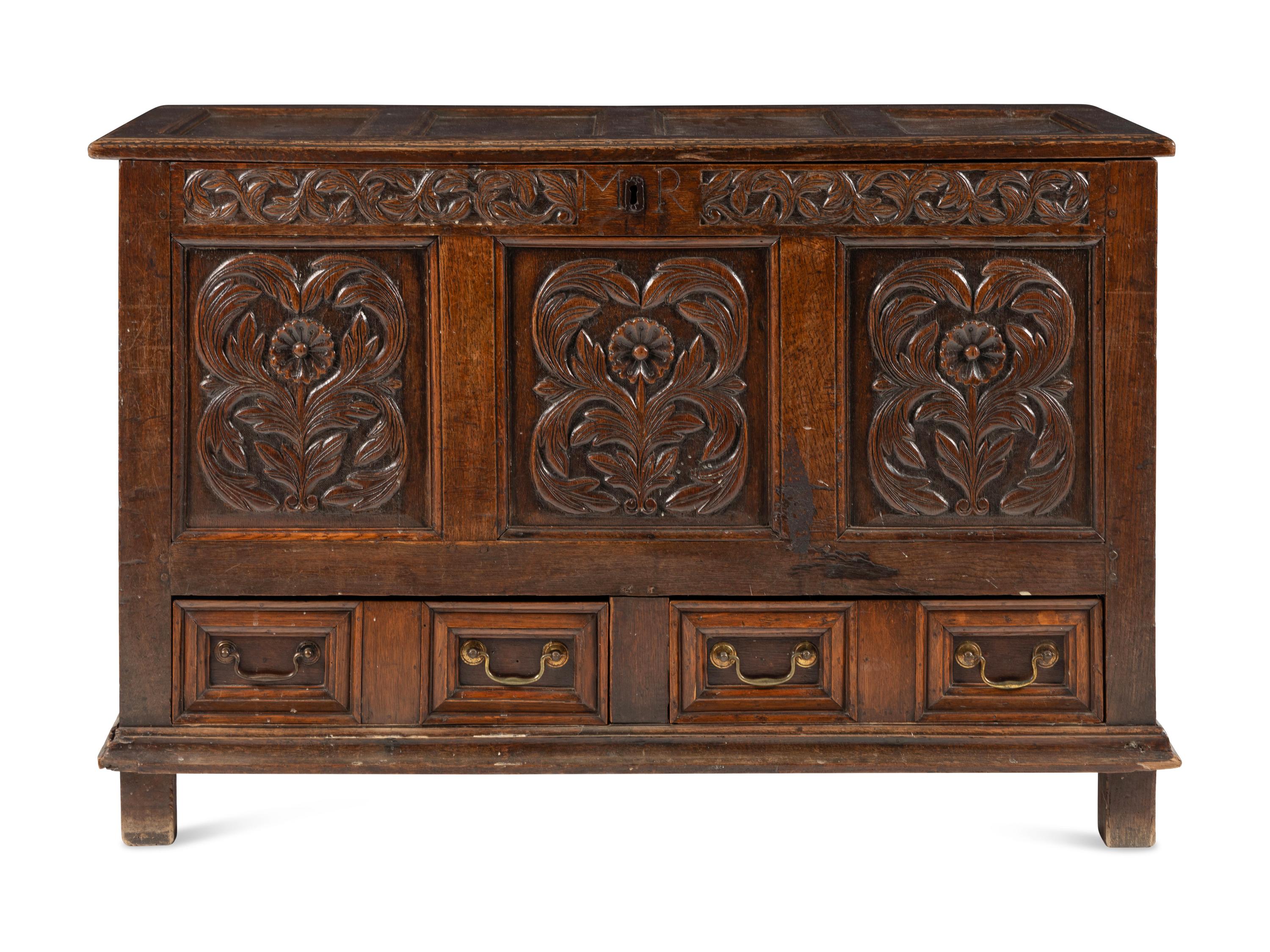 A Jacobean Carved Oak Two-Drawer Mule Chest