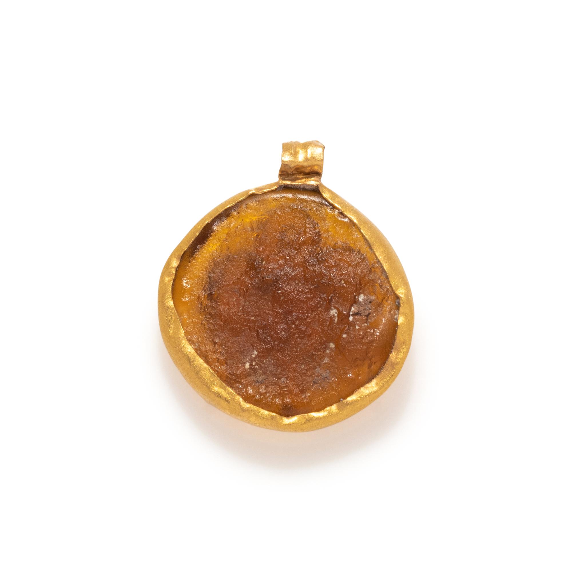 A Roman Gold and Glass Pendant with the Princess Leda and the Swan