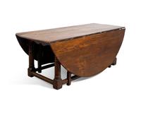 A Large Baroque Style Oak Drop-Leaf Dining Table
