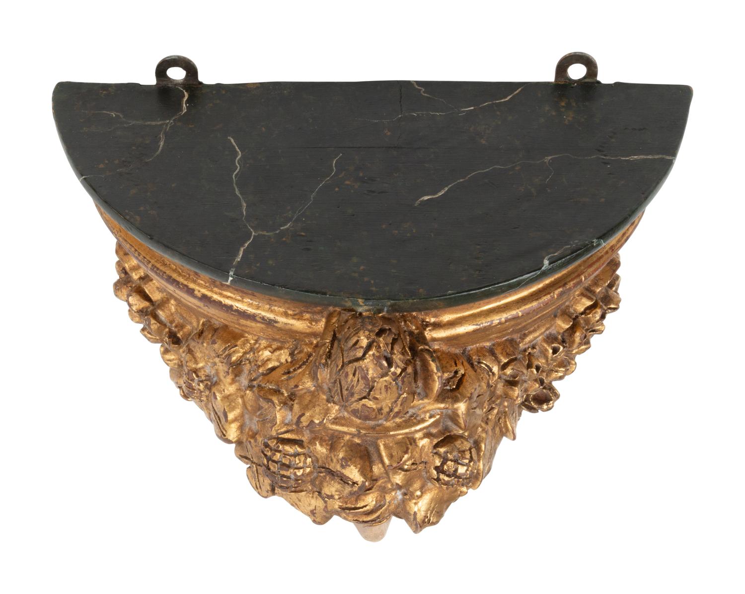 A Set of Four Italian Carved, Painted and Parcel Gilt Wall Brackets