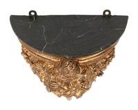 A Set of Four Italian Carved, Painted and Parcel Gilt Wall Brackets
