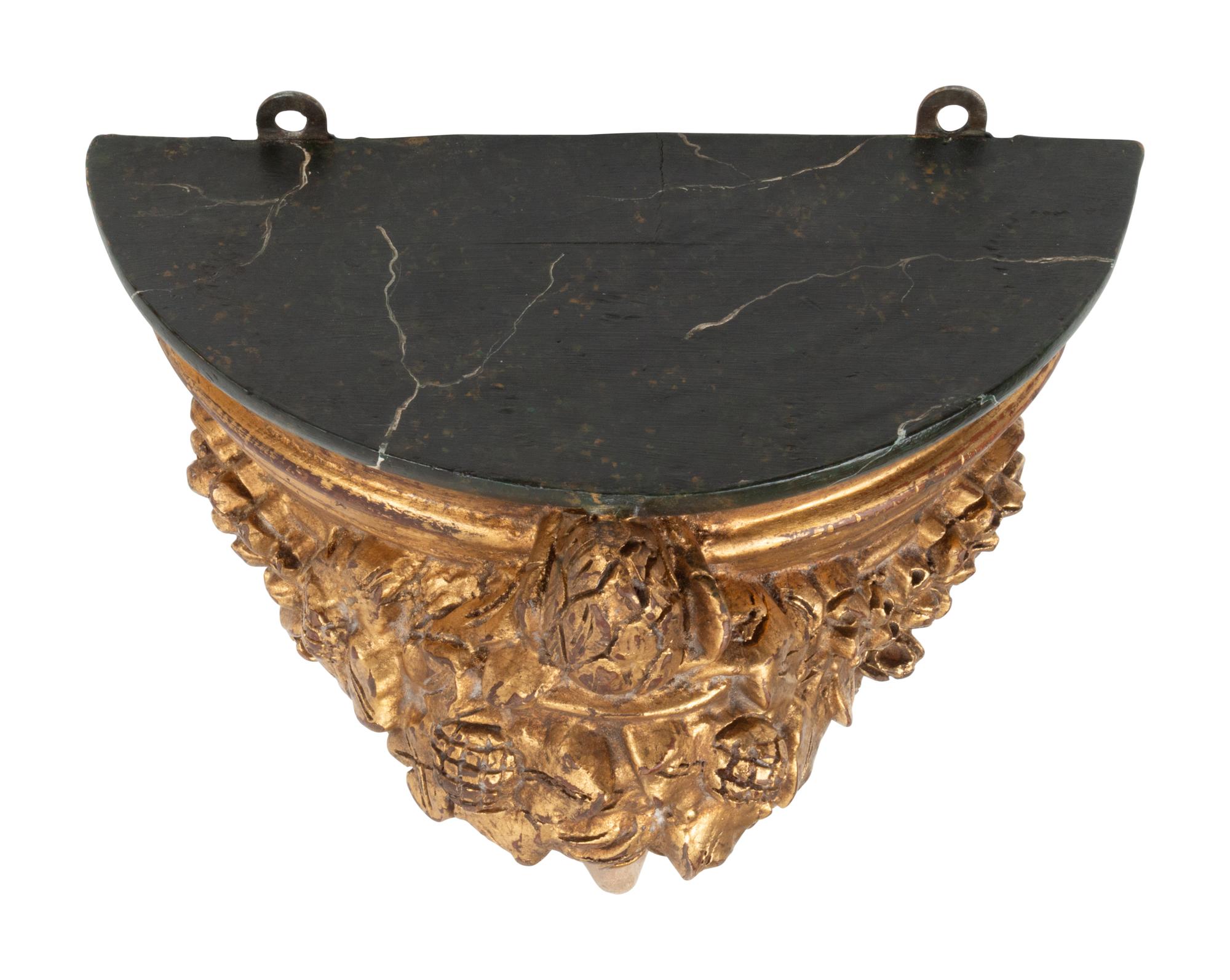 A Set of Four Italian Carved, Painted and Parcel Gilt Wall Brackets