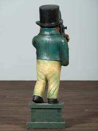 A Carved Wood Figure of a Navigator