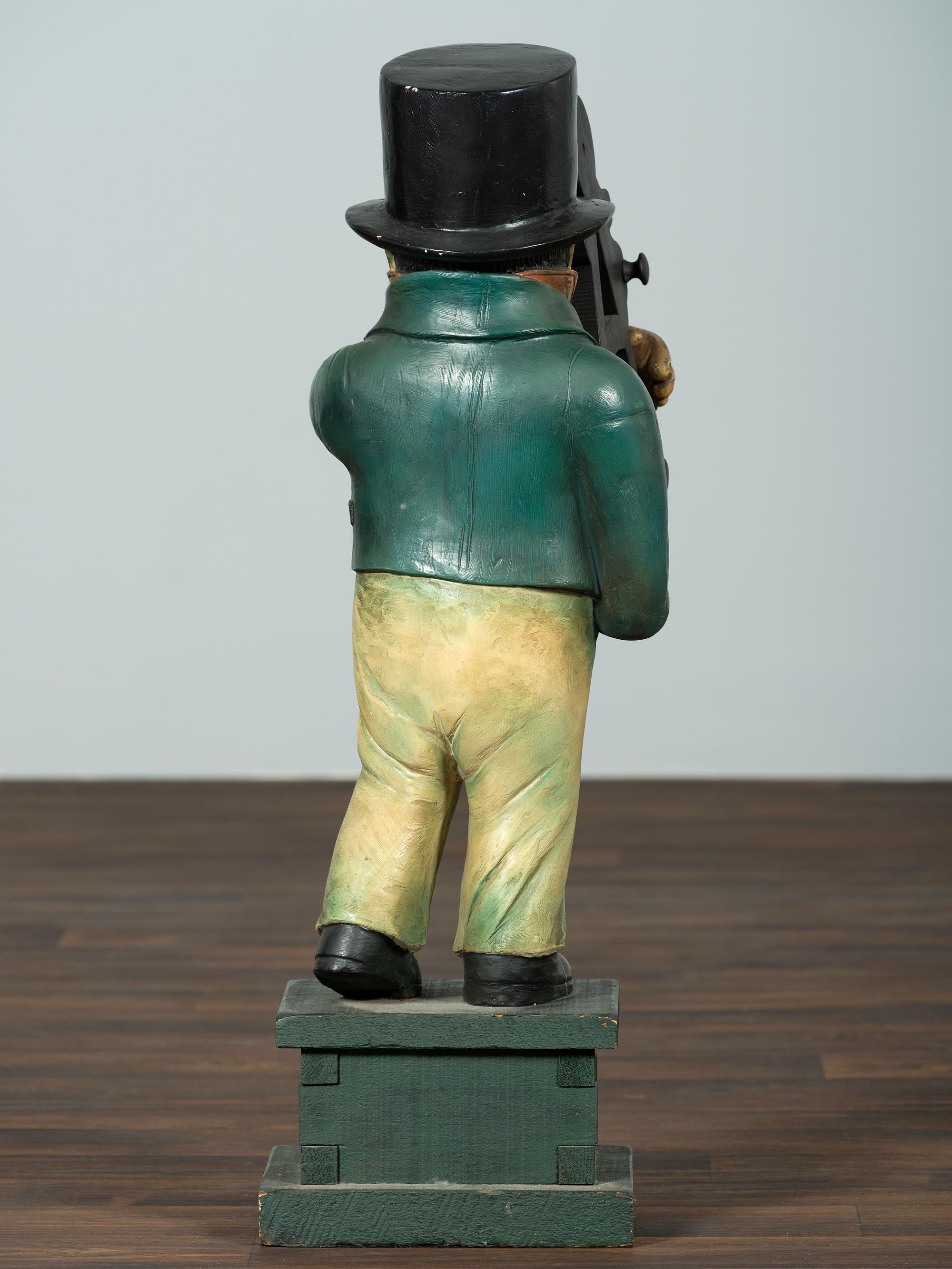 A Carved Wood Figure of a Navigator