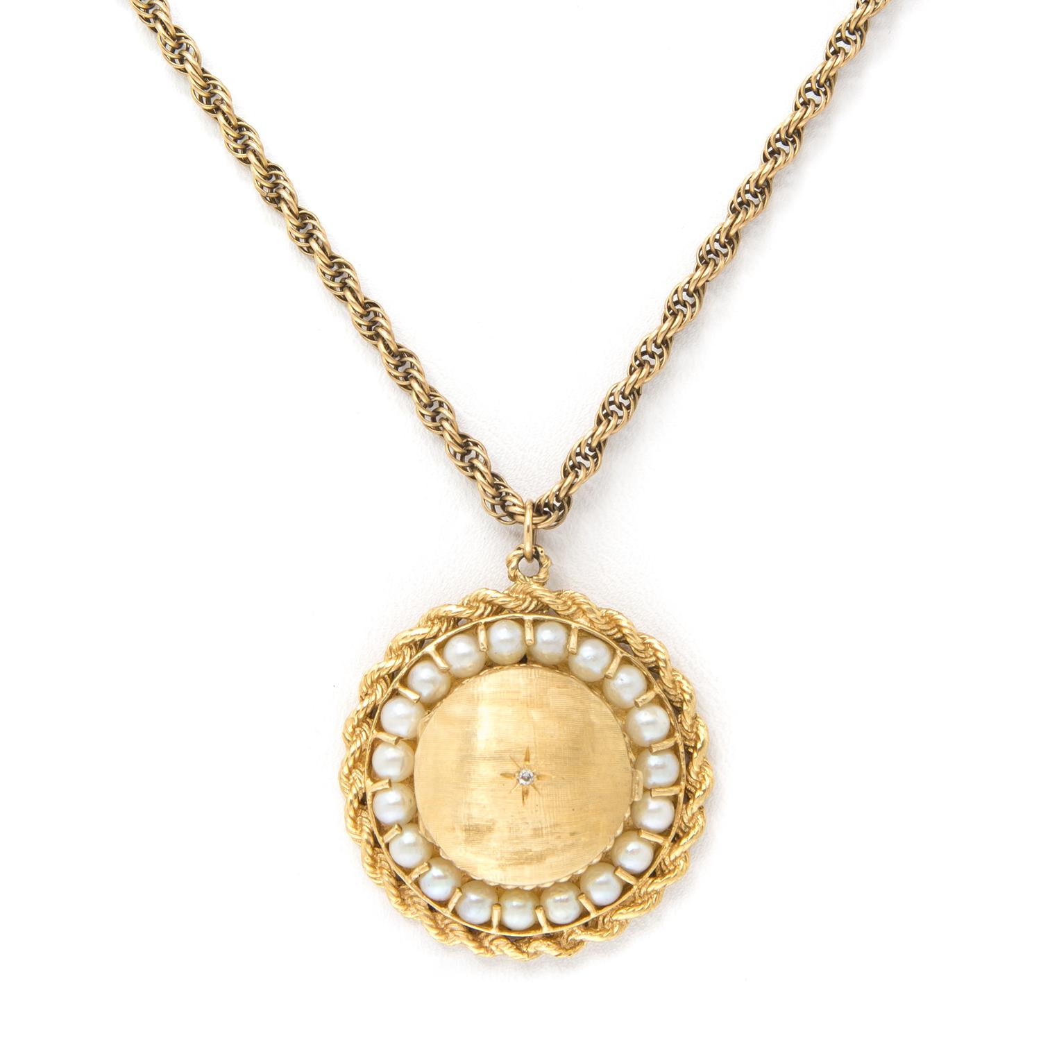 A 14 Karat Yellow Gold and Cultured Pearl Pendant, 9.40 dwts. (pendant only)