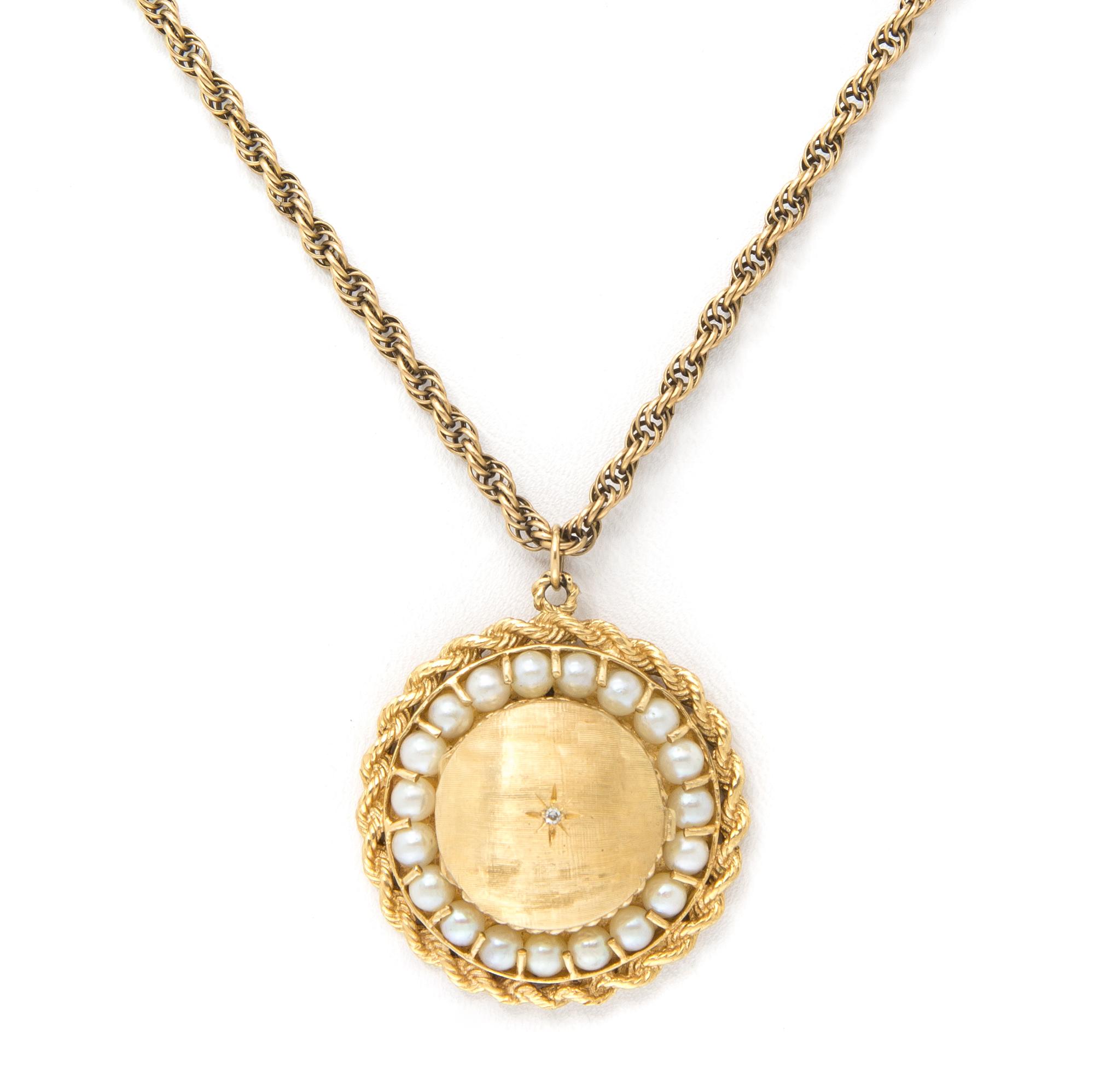 A 14 Karat Yellow Gold and Cultured Pearl Pendant, 9.40 dwts. (pendant only)