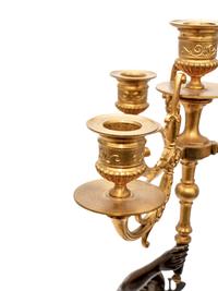 A Pair of Gilt and Patinated Bronze Figural Four-Light Candelabra