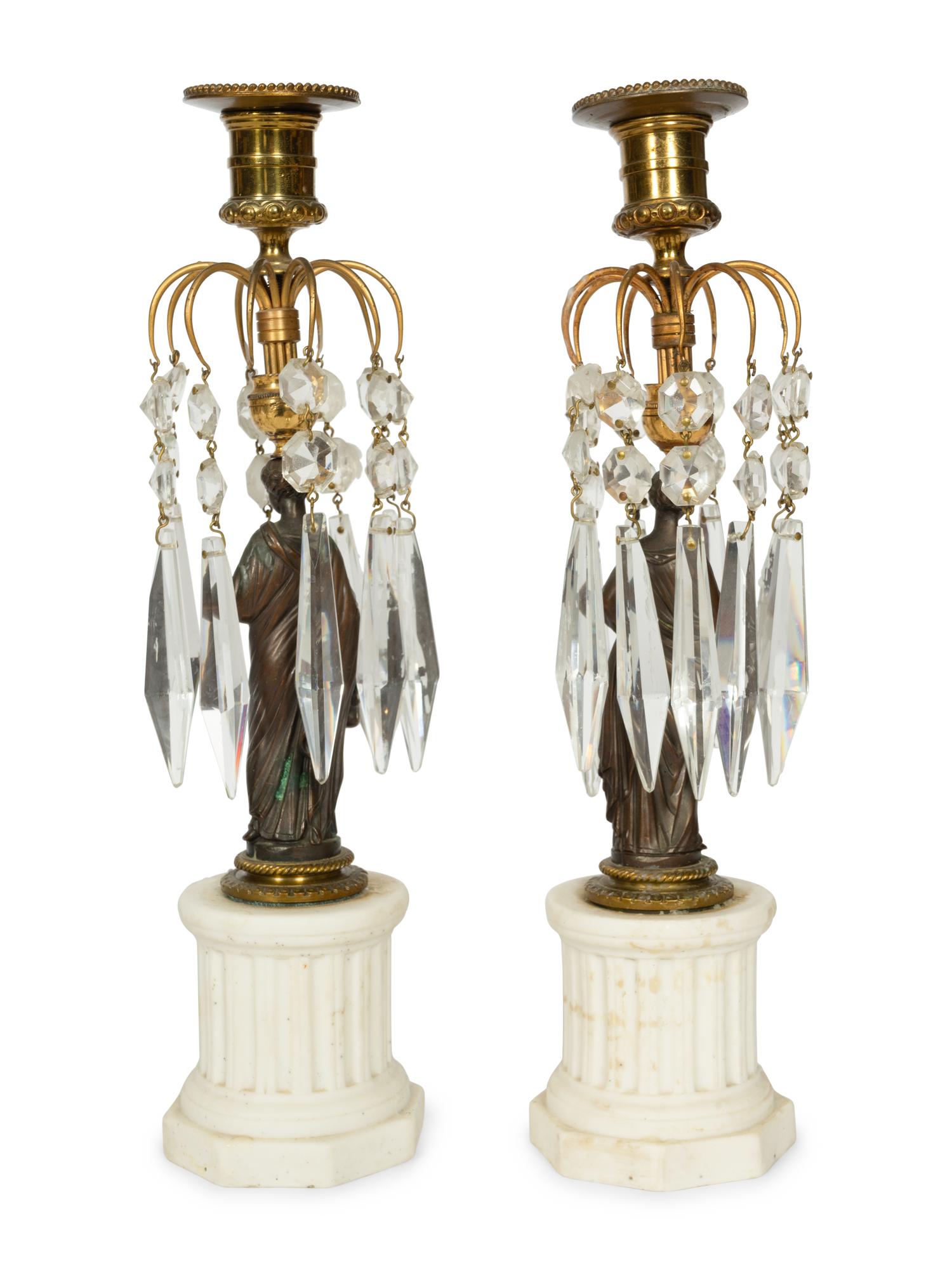 A Pair of French Patinated Bronze and Biscuit Porcelain Candlesticks