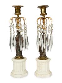 A Pair of French Patinated Bronze and Biscuit Porcelain Candlesticks