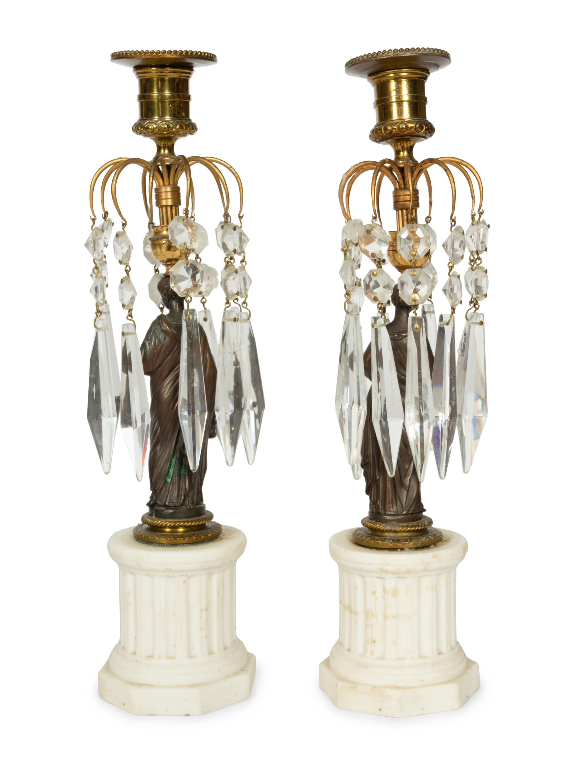 A Pair of French Patinated Bronze and Biscuit Porcelain Candlesticks