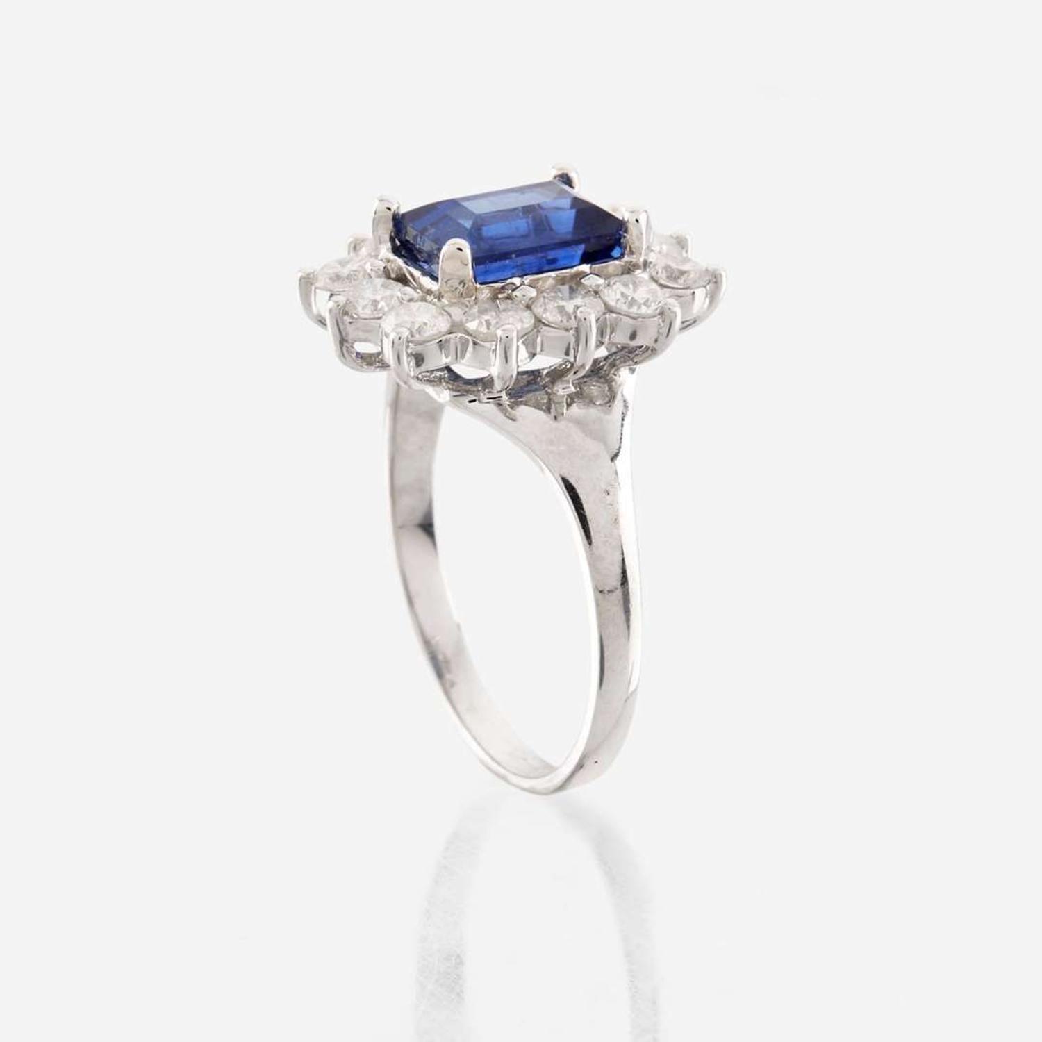 A sapphire, diamond, and white gold ring