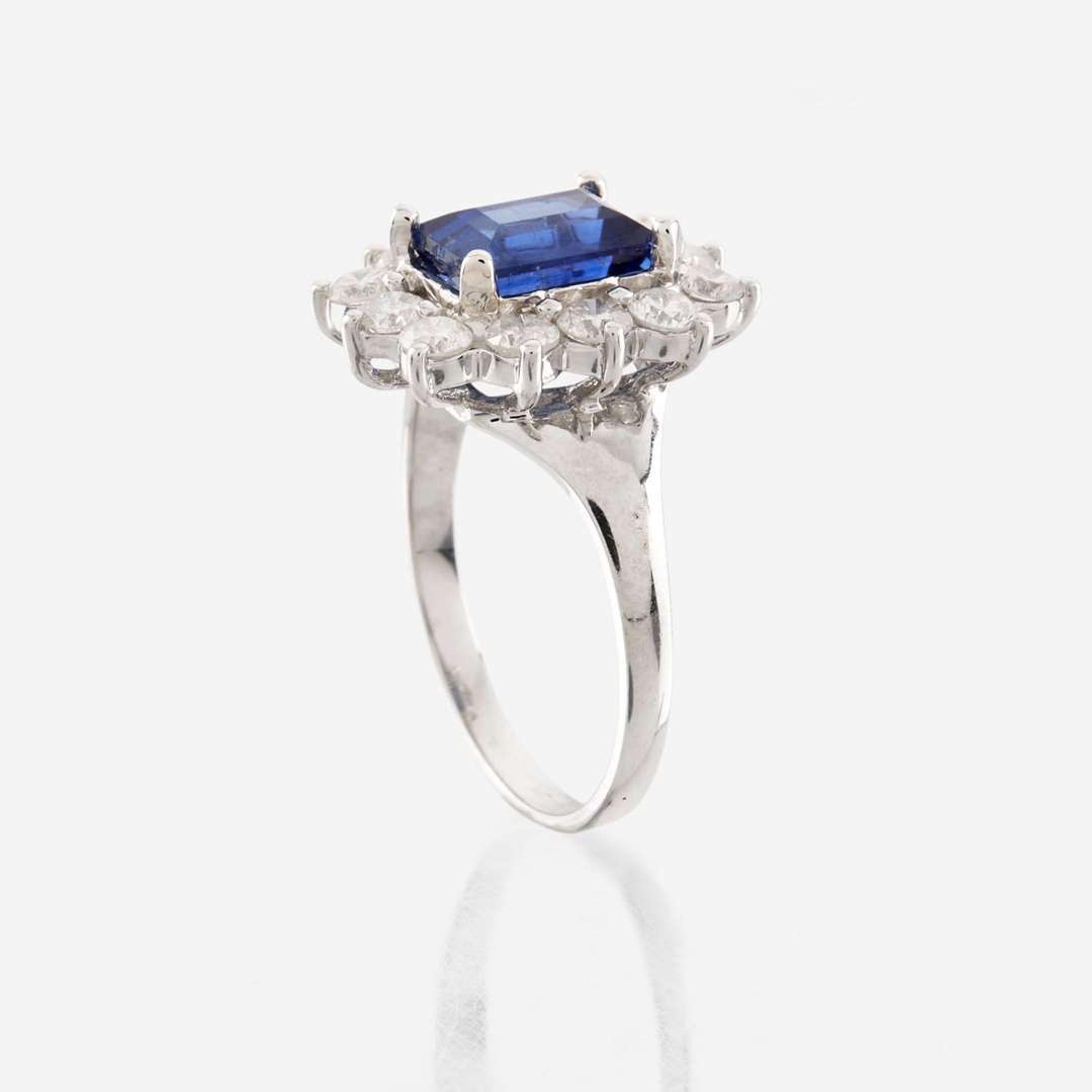 A sapphire, diamond, and white gold ring