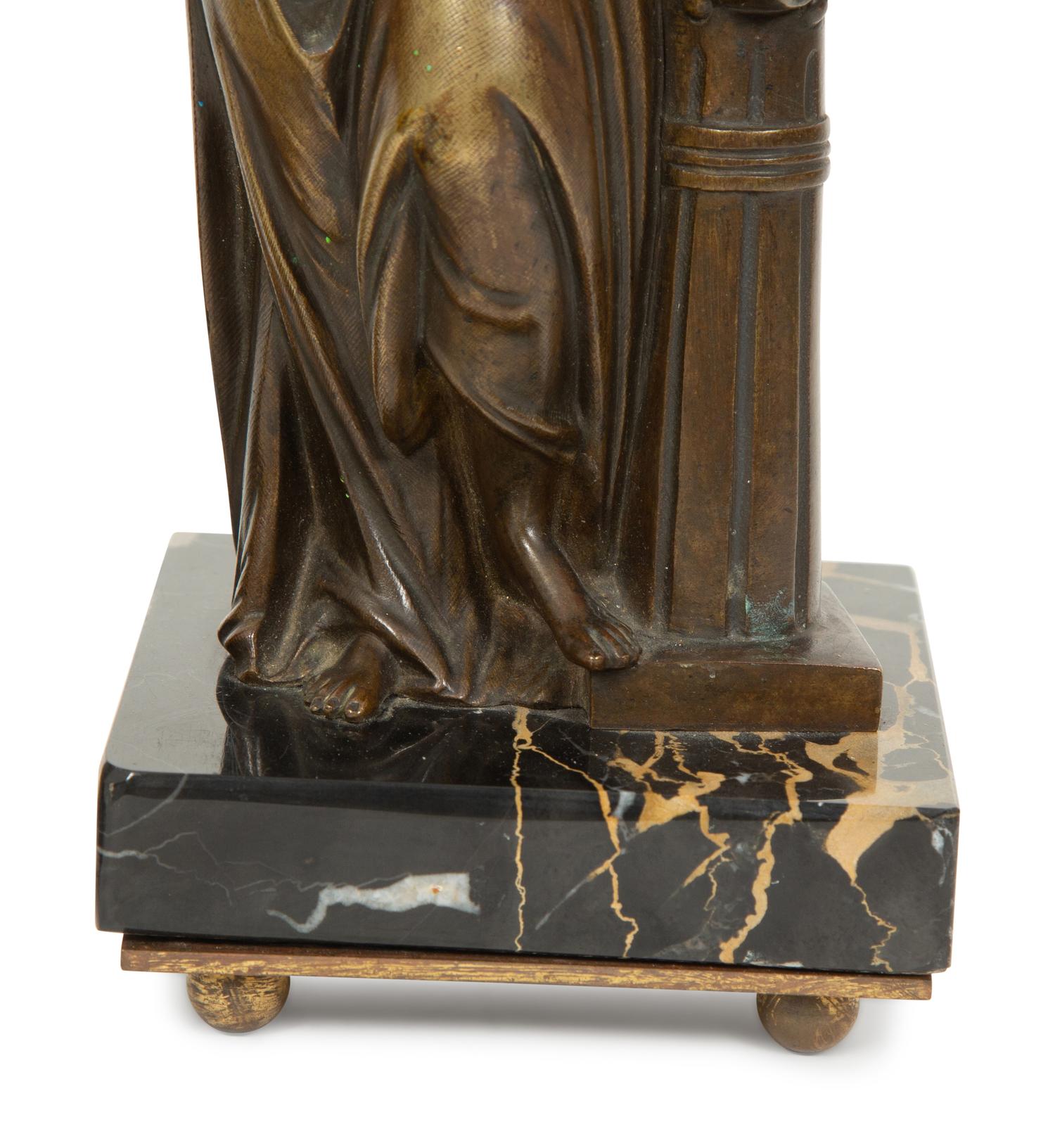 A Pair of French Bronze and Marble Figural Candlesticks