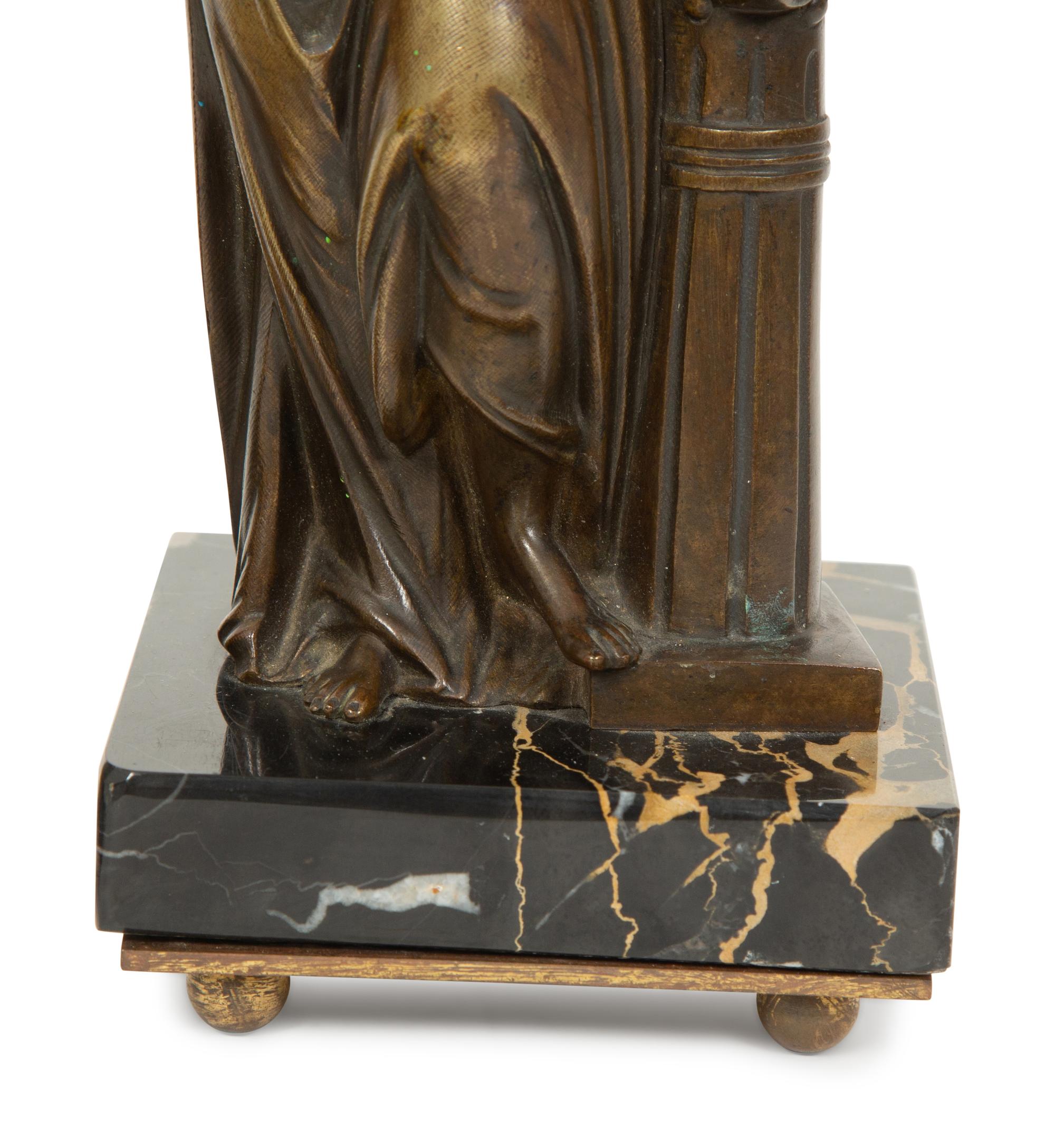 A Pair of French Bronze and Marble Figural Candlesticks
