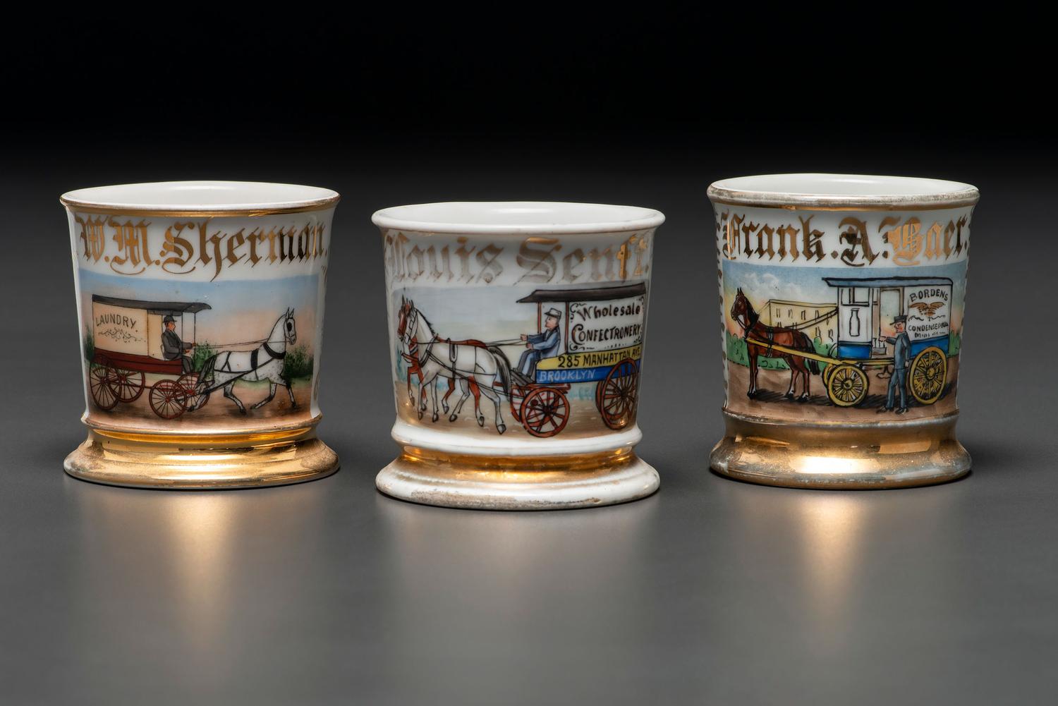 Three Porcelain Occupational Shaving Mugs Depicting Horse-Drawn Delivery Wagons