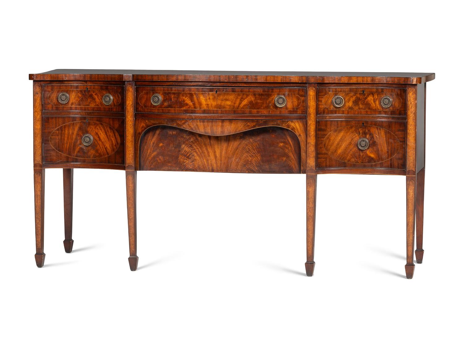 A Regency Style "Plum-Pudding" Mahogany Serpentine Sideboard