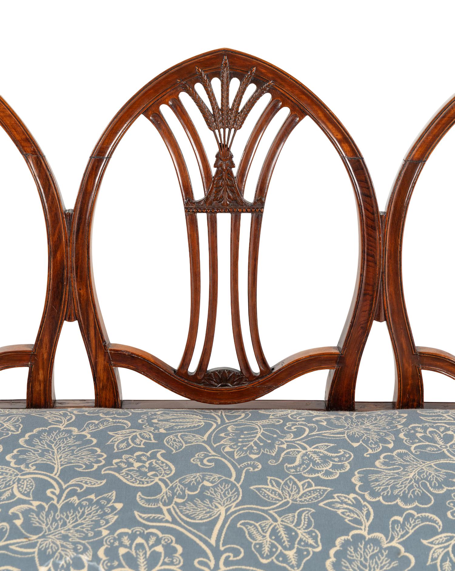 A George III Mahogany Triple-Back Settee