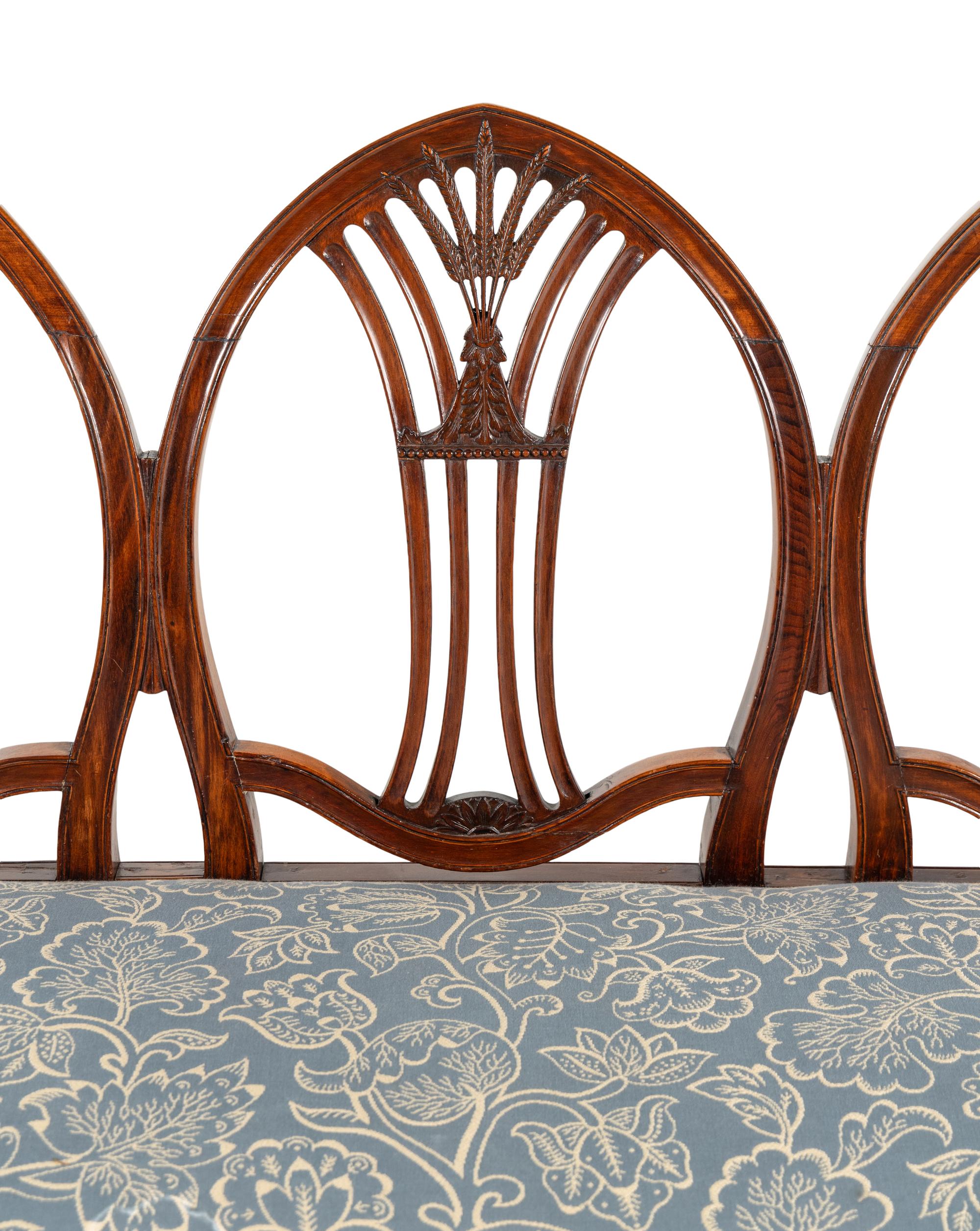 A George III Mahogany Triple-Back Settee