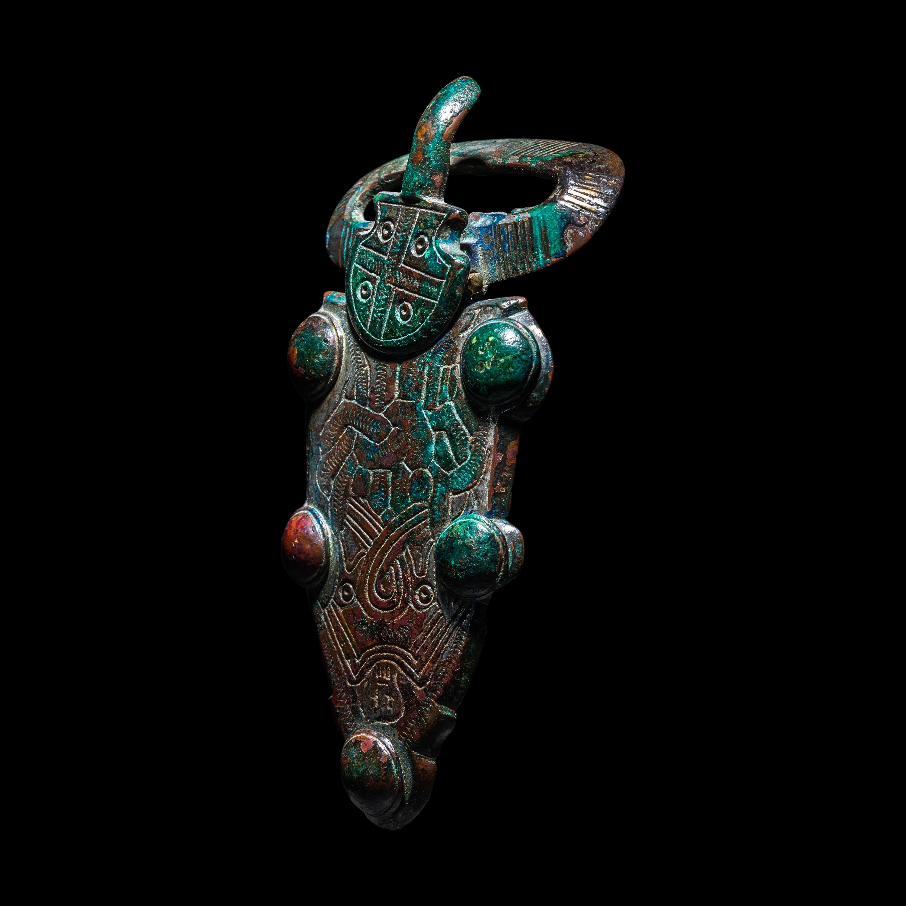A Merovingian Tinned-Bronze Belt Buckle