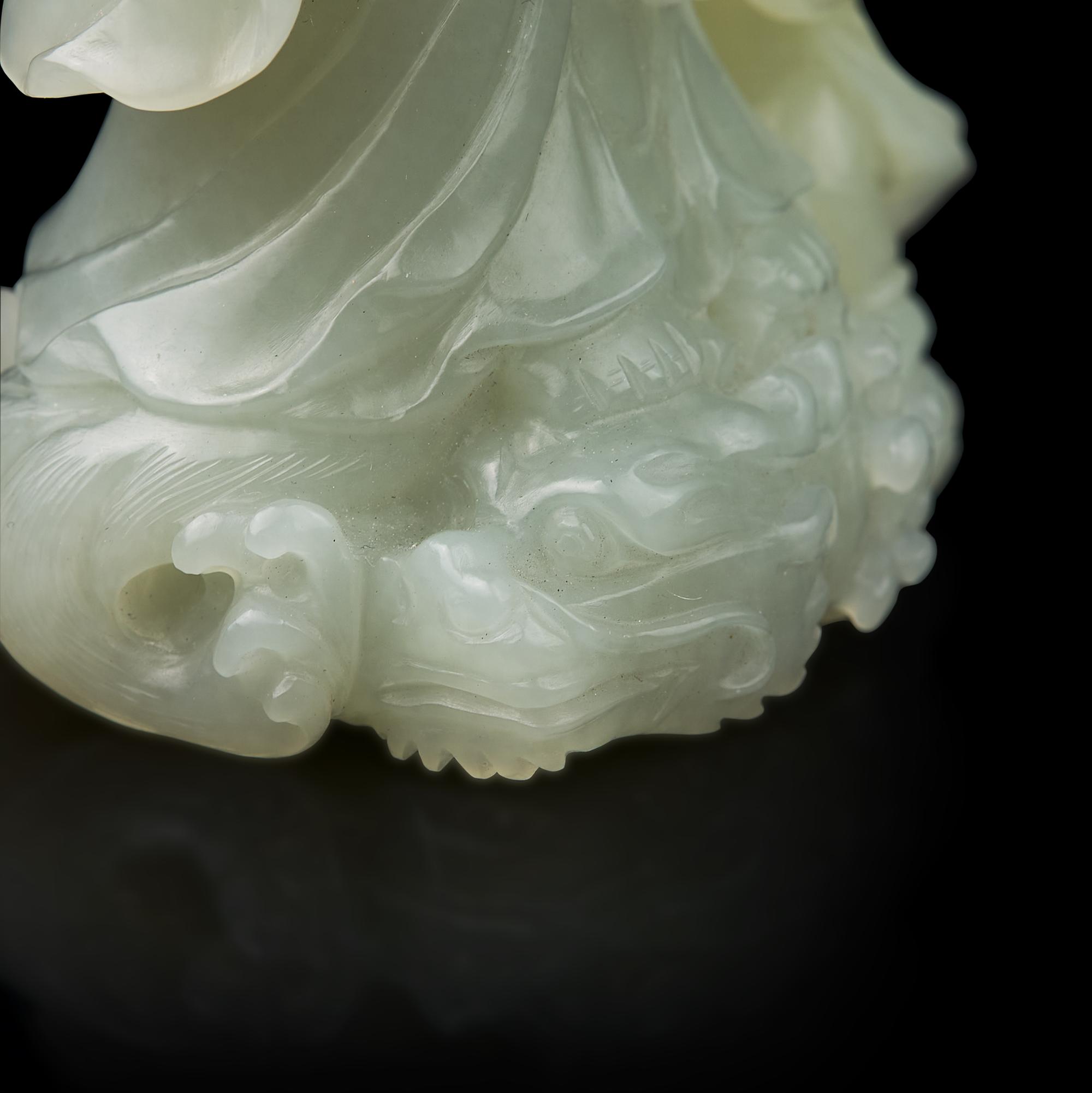 A Chinese Jade Figural Group of Guanyin and Boy 青白玉雕送子觀音