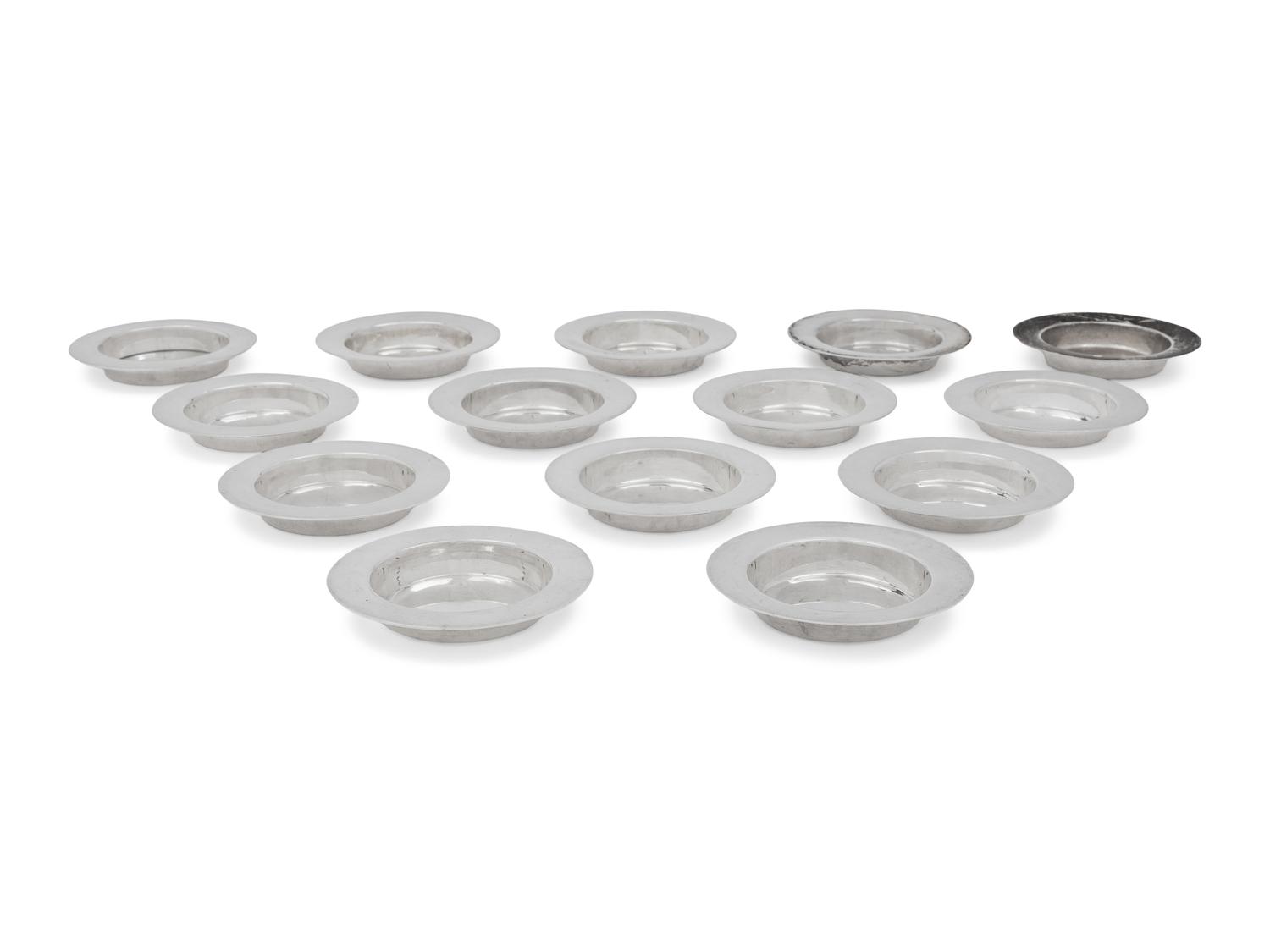A Set of Fourteen English Silver Place-Setting Ash Trays