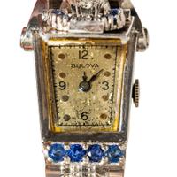 BULOVA, RETRO, WHITE GOLD, DIAMOND, AND SAPPHIRE HIDDEN DIAL WATCH