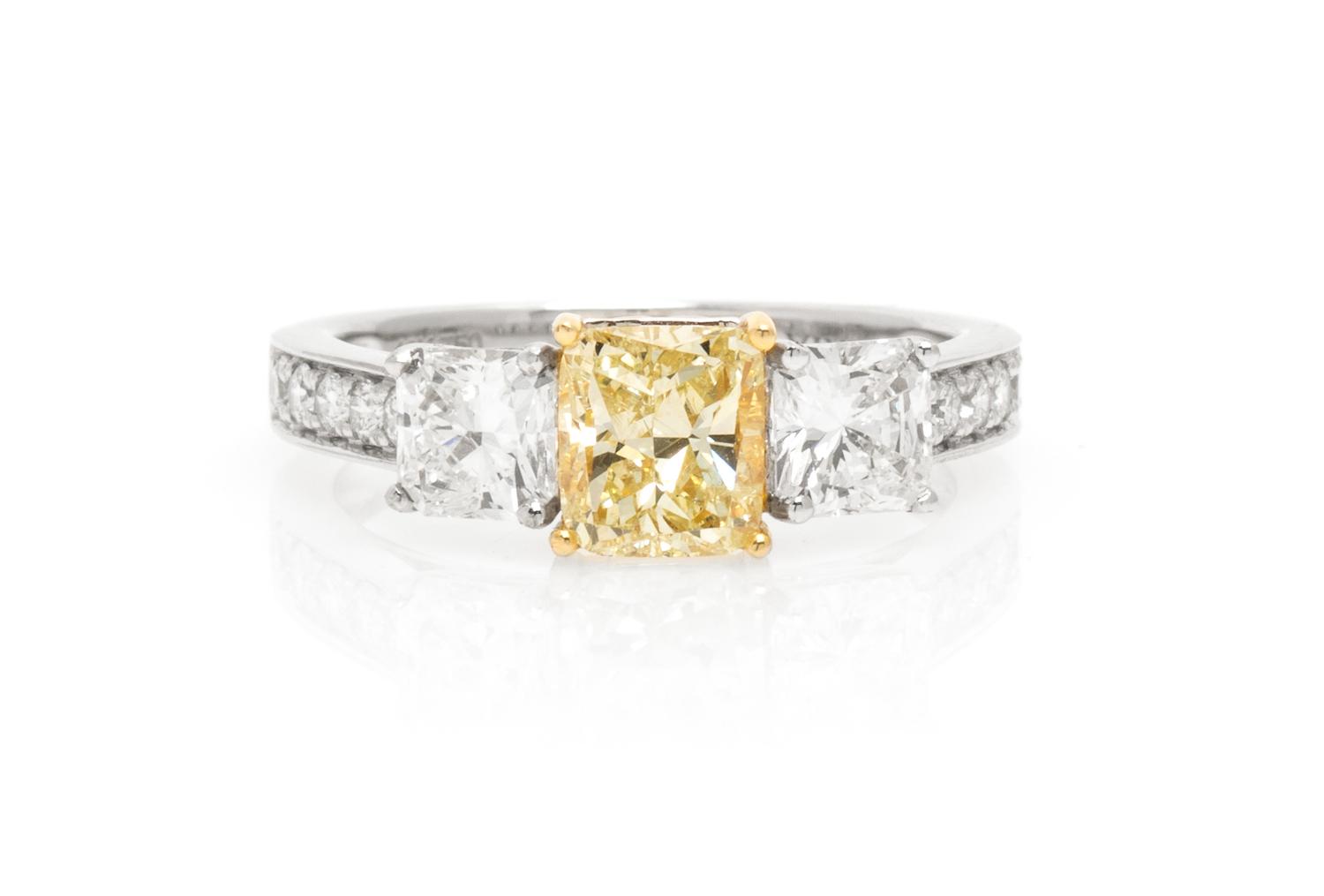 An 18 Karat White Gold, Colored Diamond and Diamond Ring, 2.50 dwts.