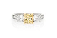 An 18 Karat White Gold, Colored Diamond and Diamond Ring, 2.50 dwts.