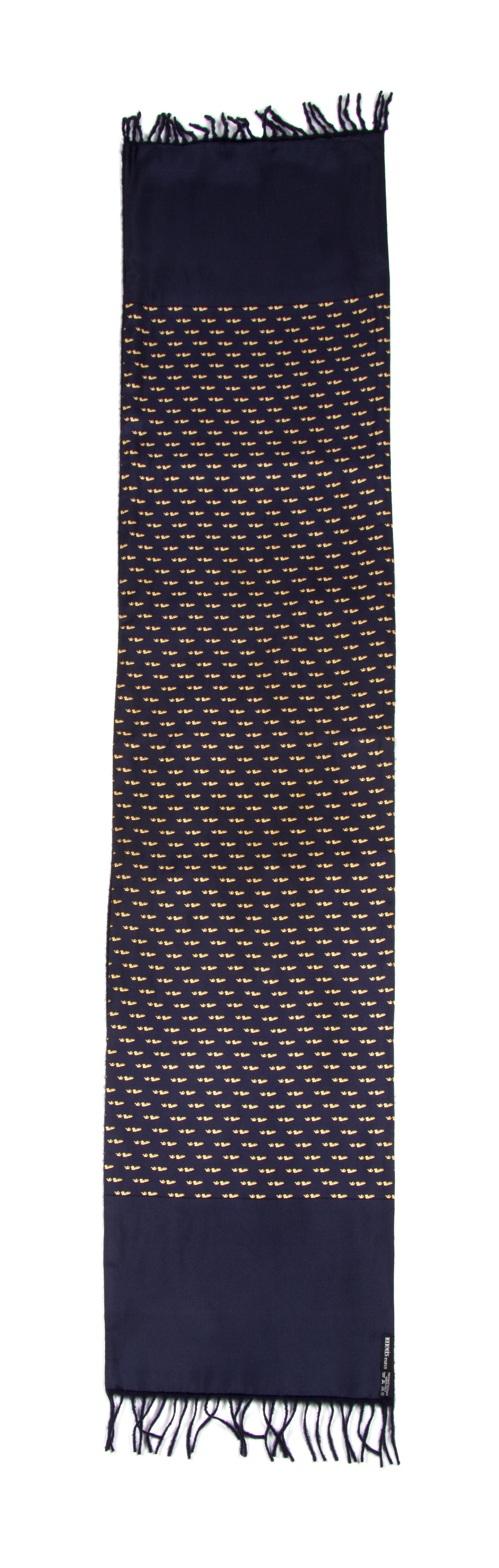 An Hermes Navy Cashmere and Silk Muffler, 54" x 11".