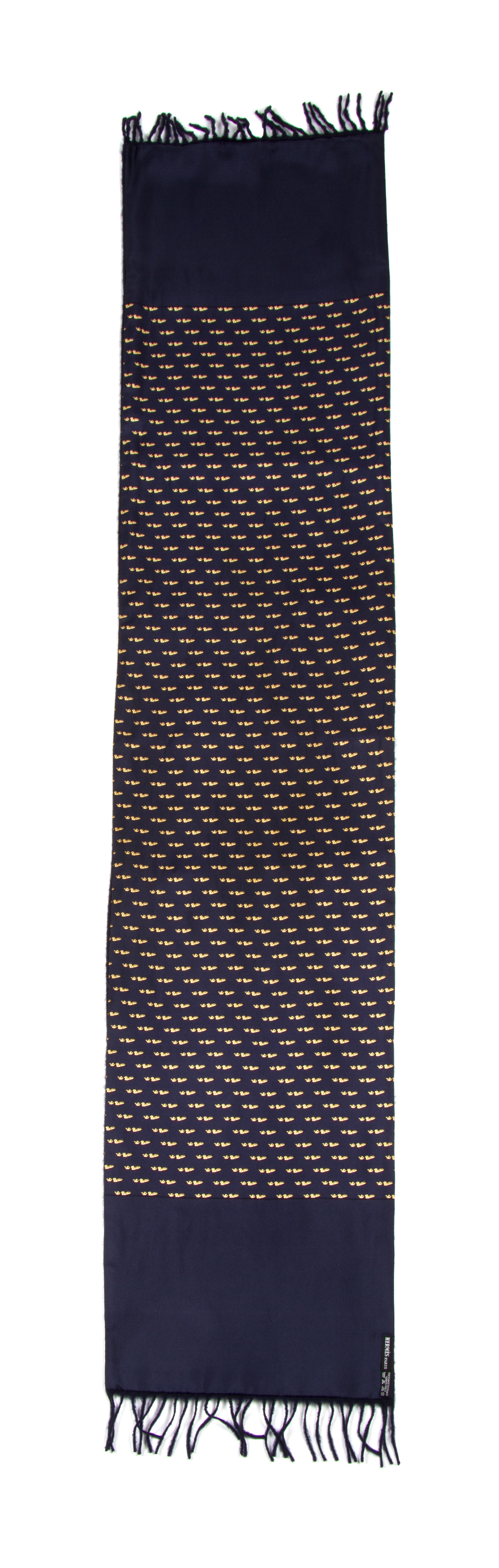 An Hermes Navy Cashmere and Silk Muffler, 54" x 11".