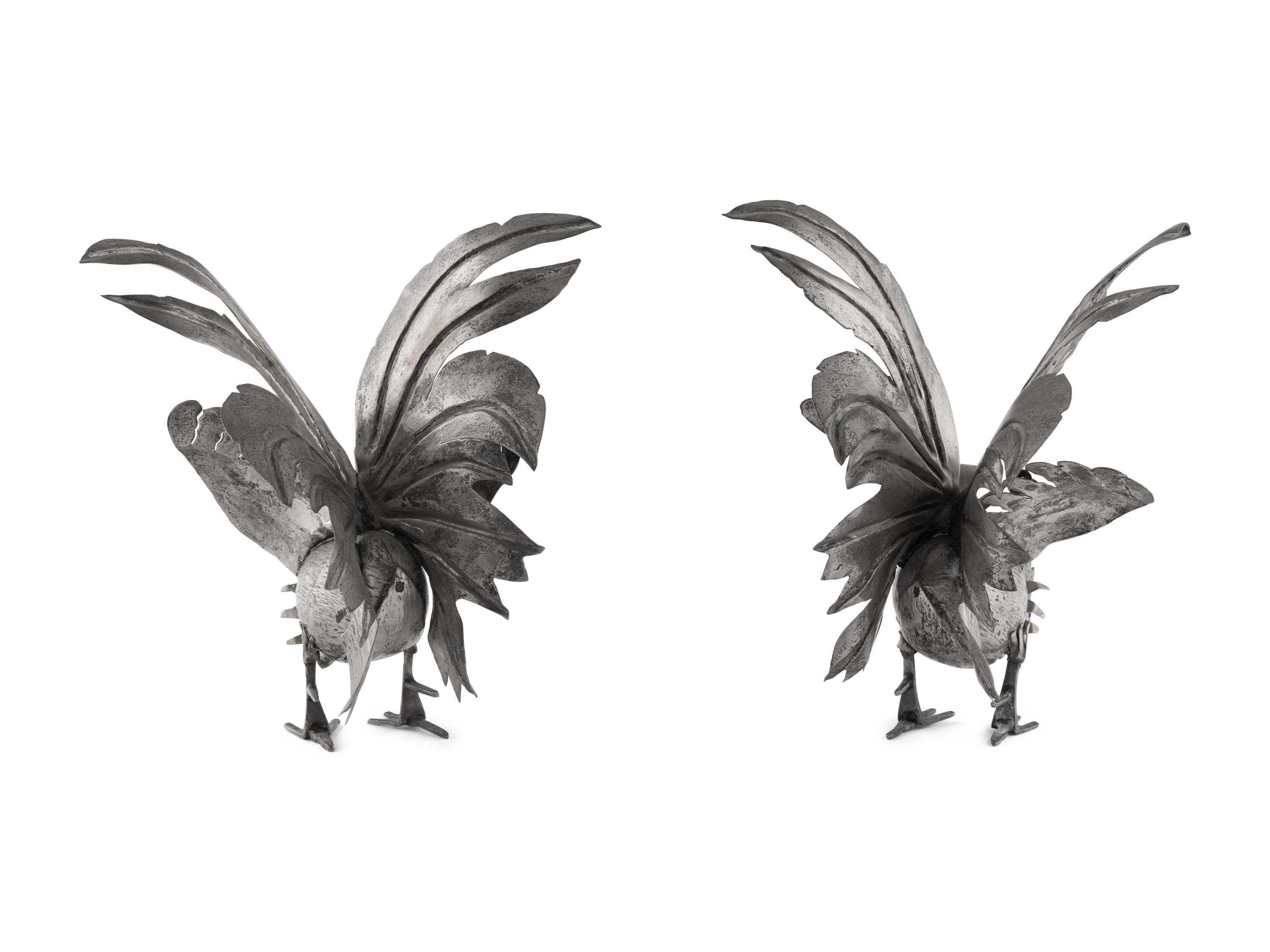 A Pair of Continental Silvered-Metal Roosters